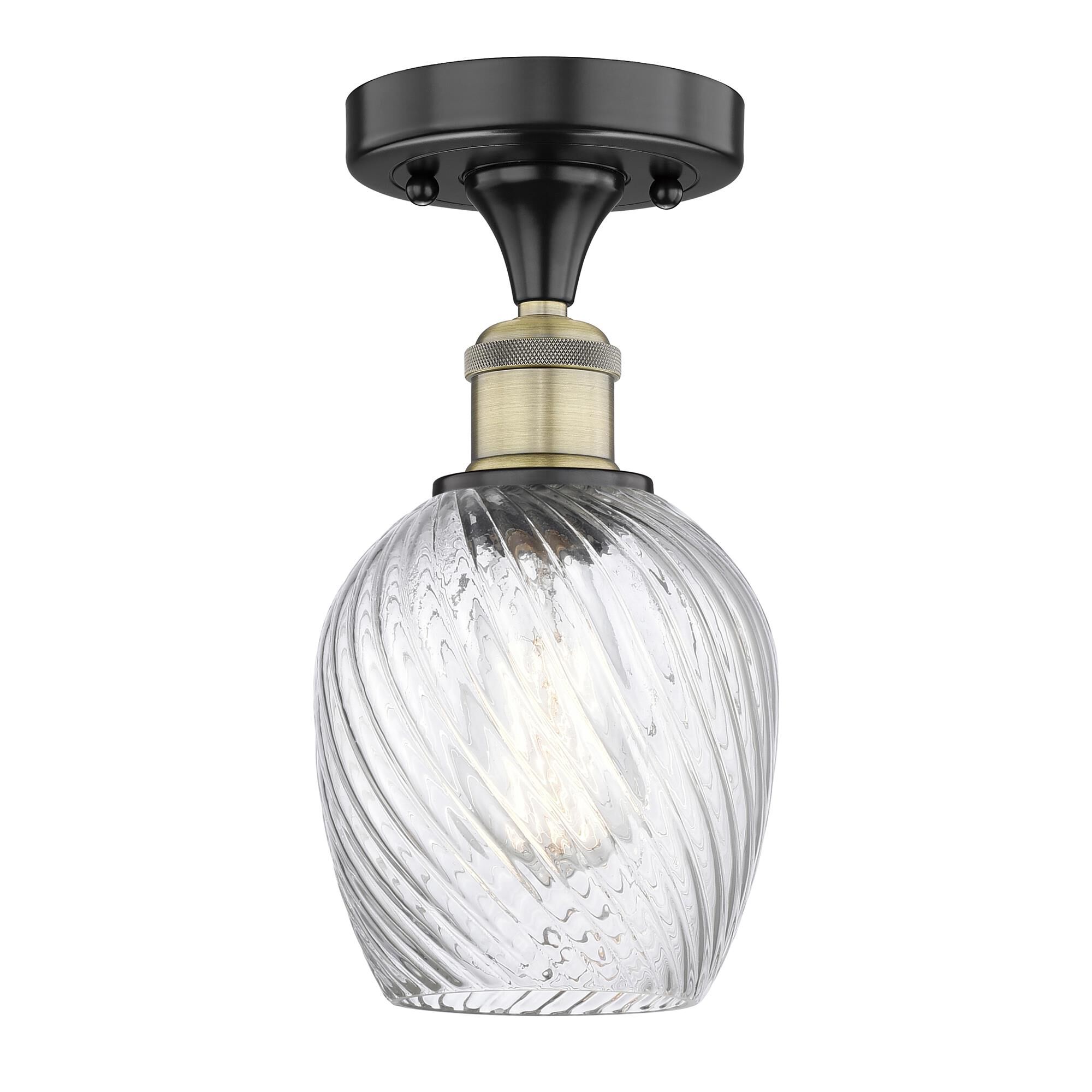 Shown in Black Antique Brass finish and Clear Spiral Fluted glass