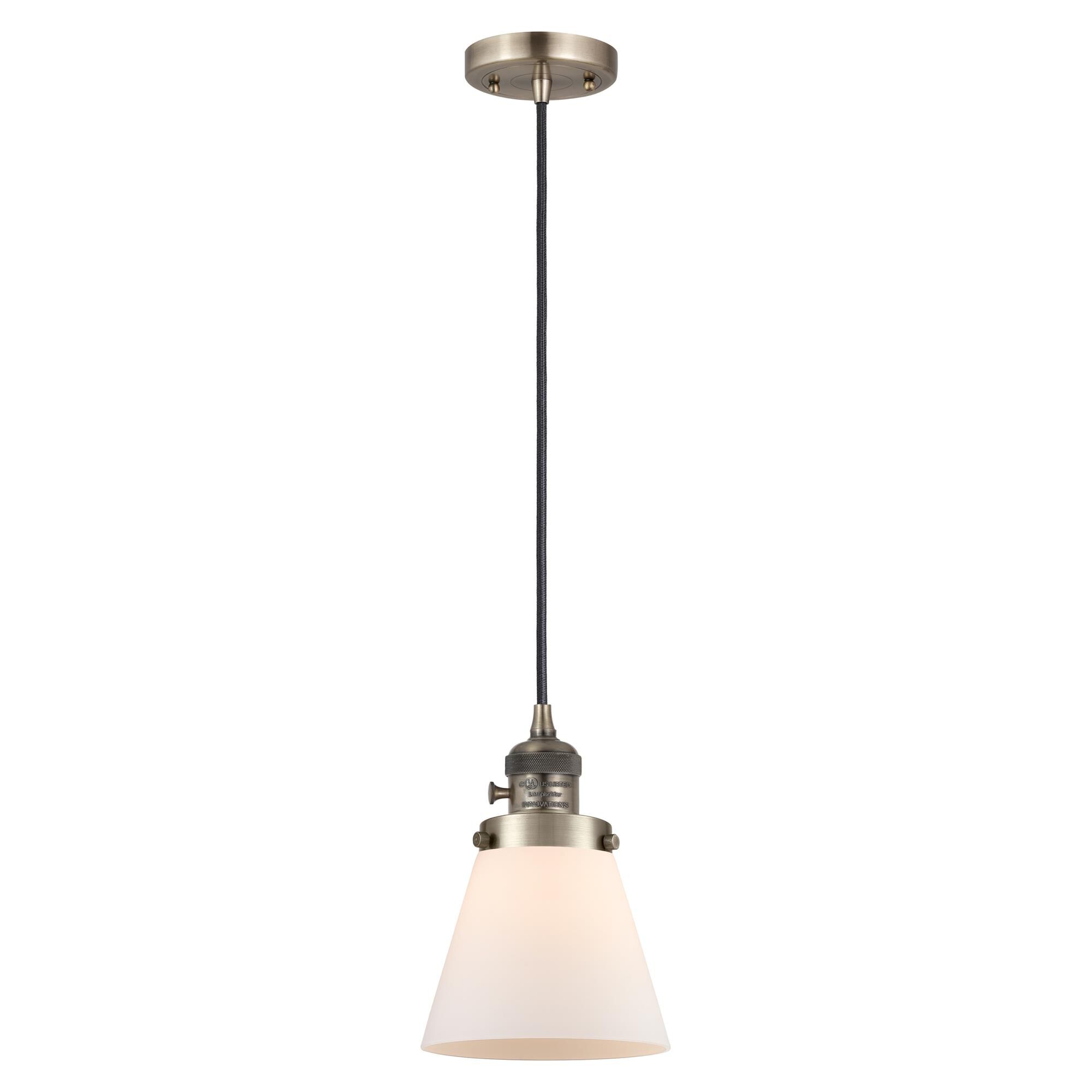 Shown in Antique Brass finish and Matte White Cased glass