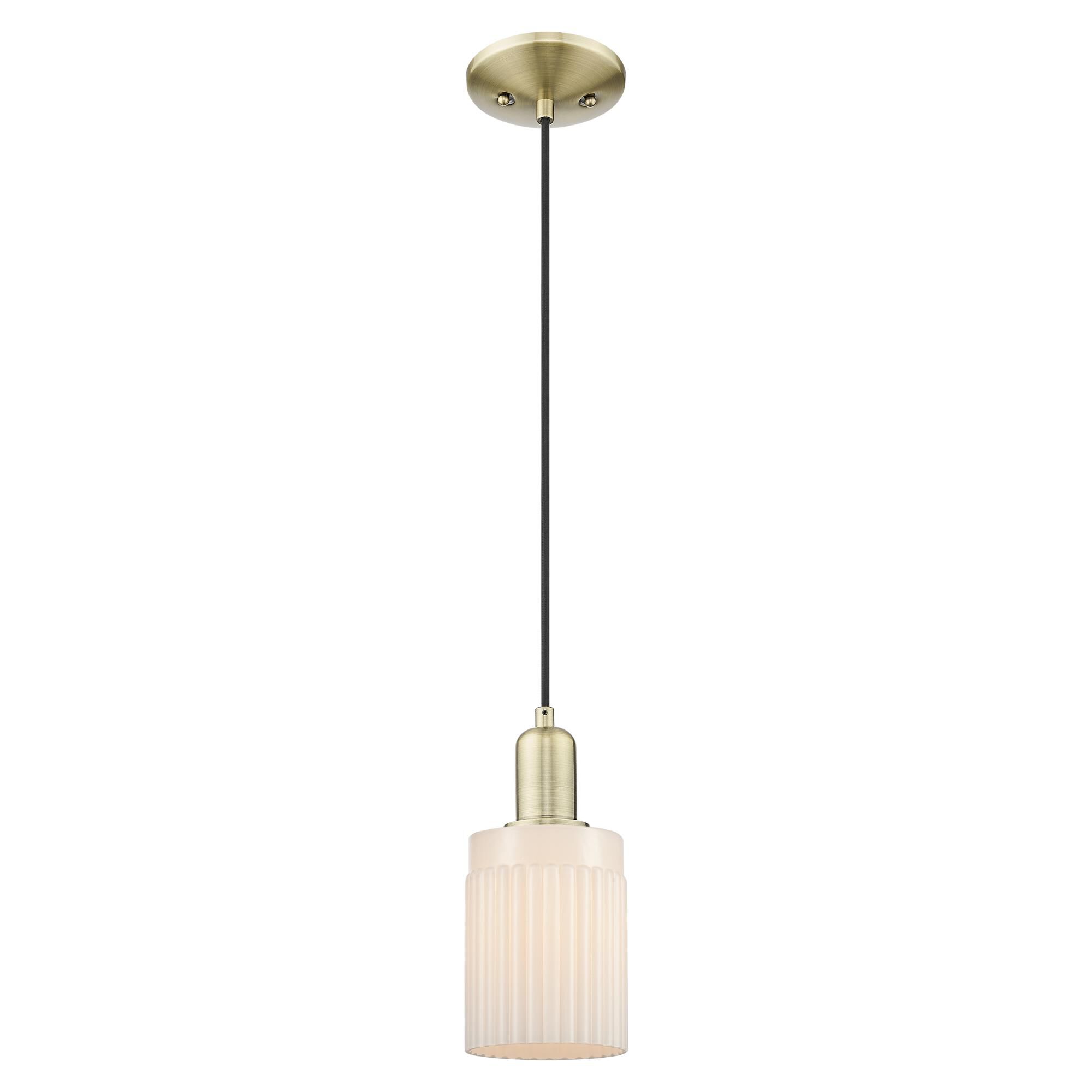 Shown in Antique Brass finish and Matte White glass