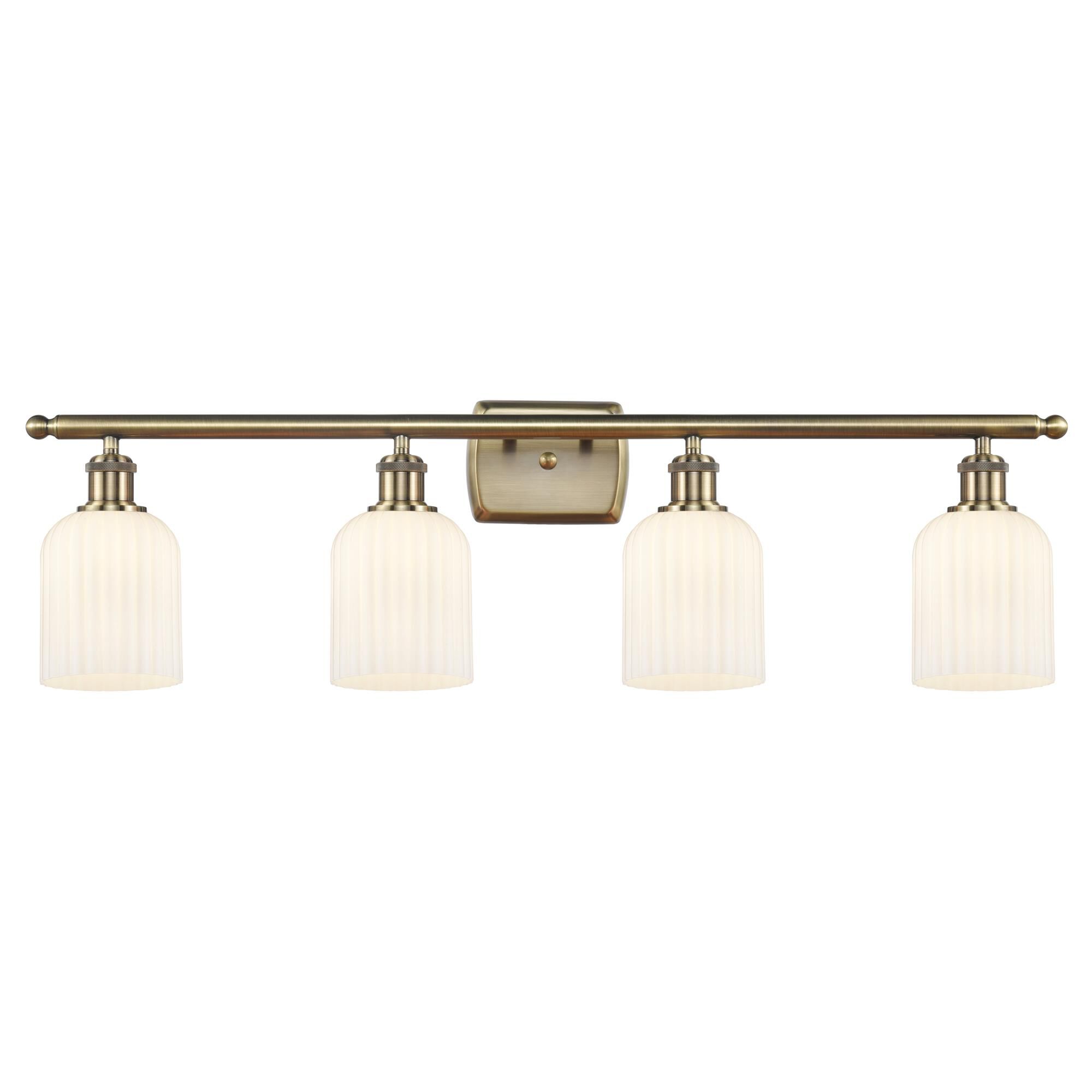 Shown in Antique Brass finish and Gloss White shade