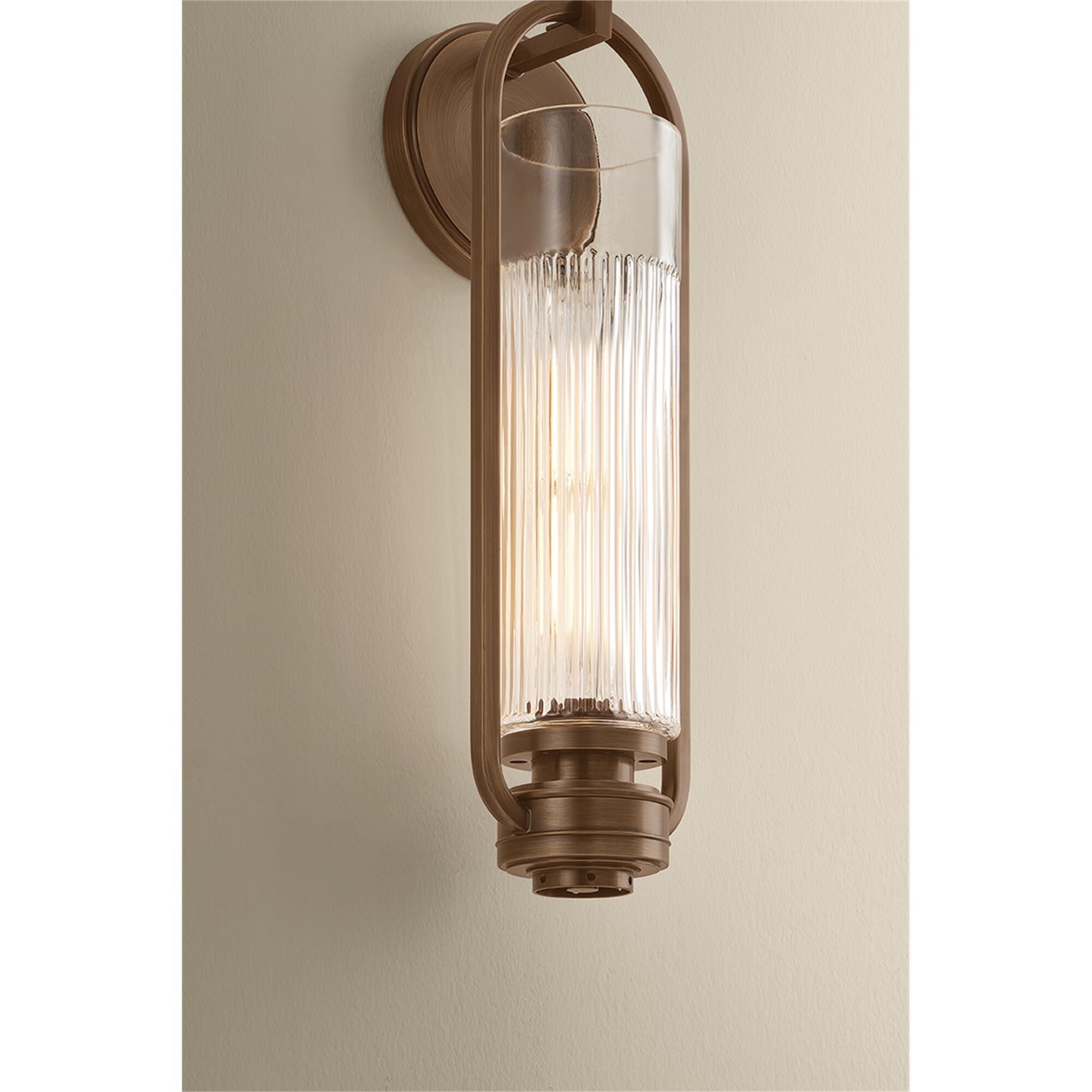 Shown in Aged Brass finish and Clear Optic glass