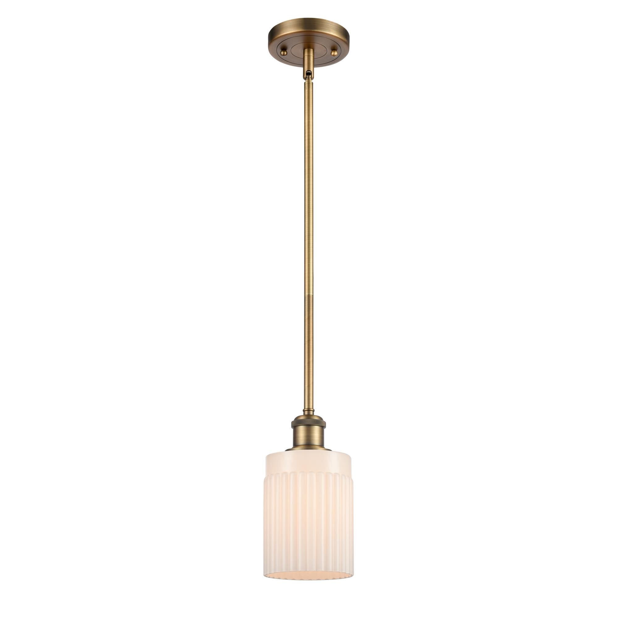 Shown in Brushed Brass finish and White Ribbed shade