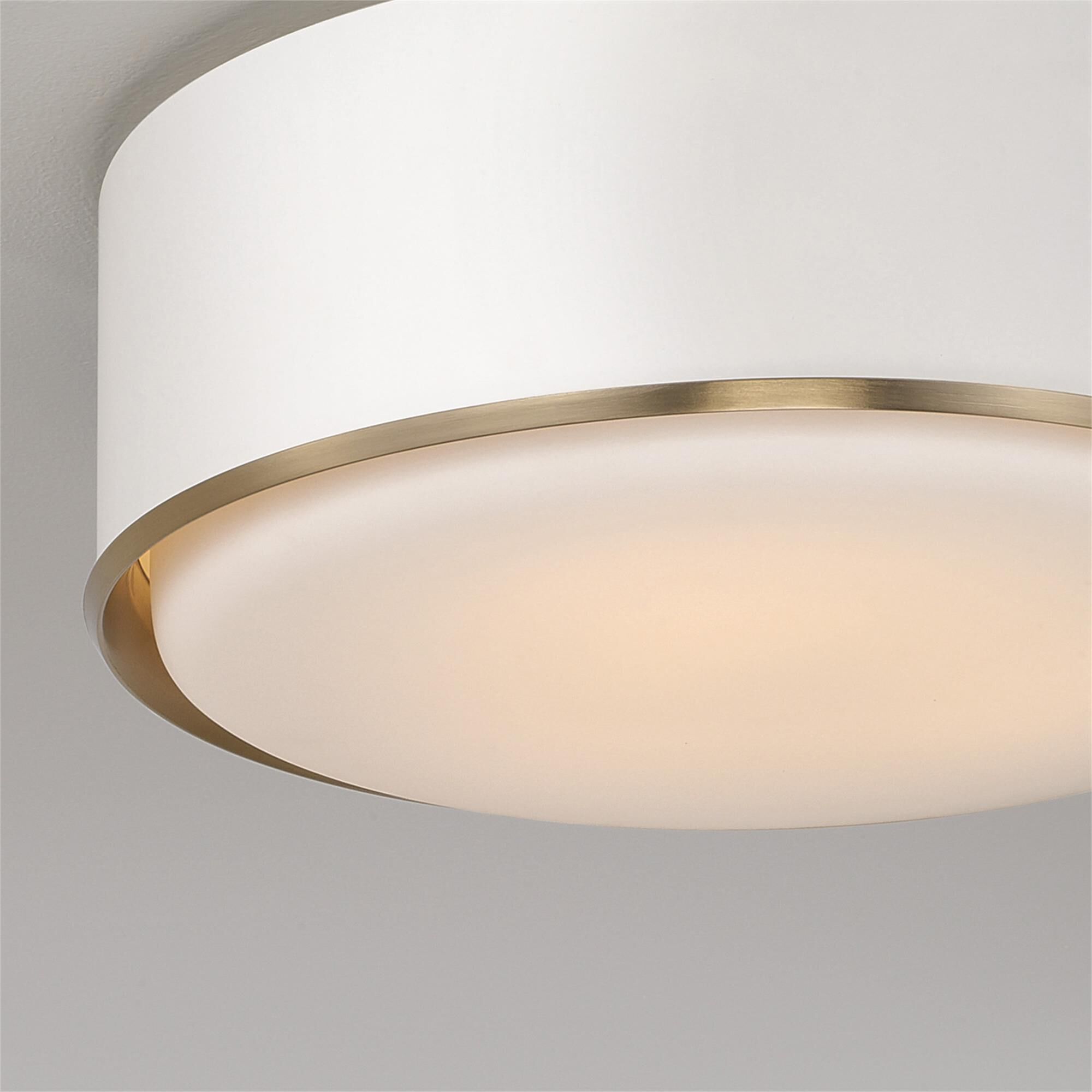 Shown in Matte Brass And White finish and Soft White glass