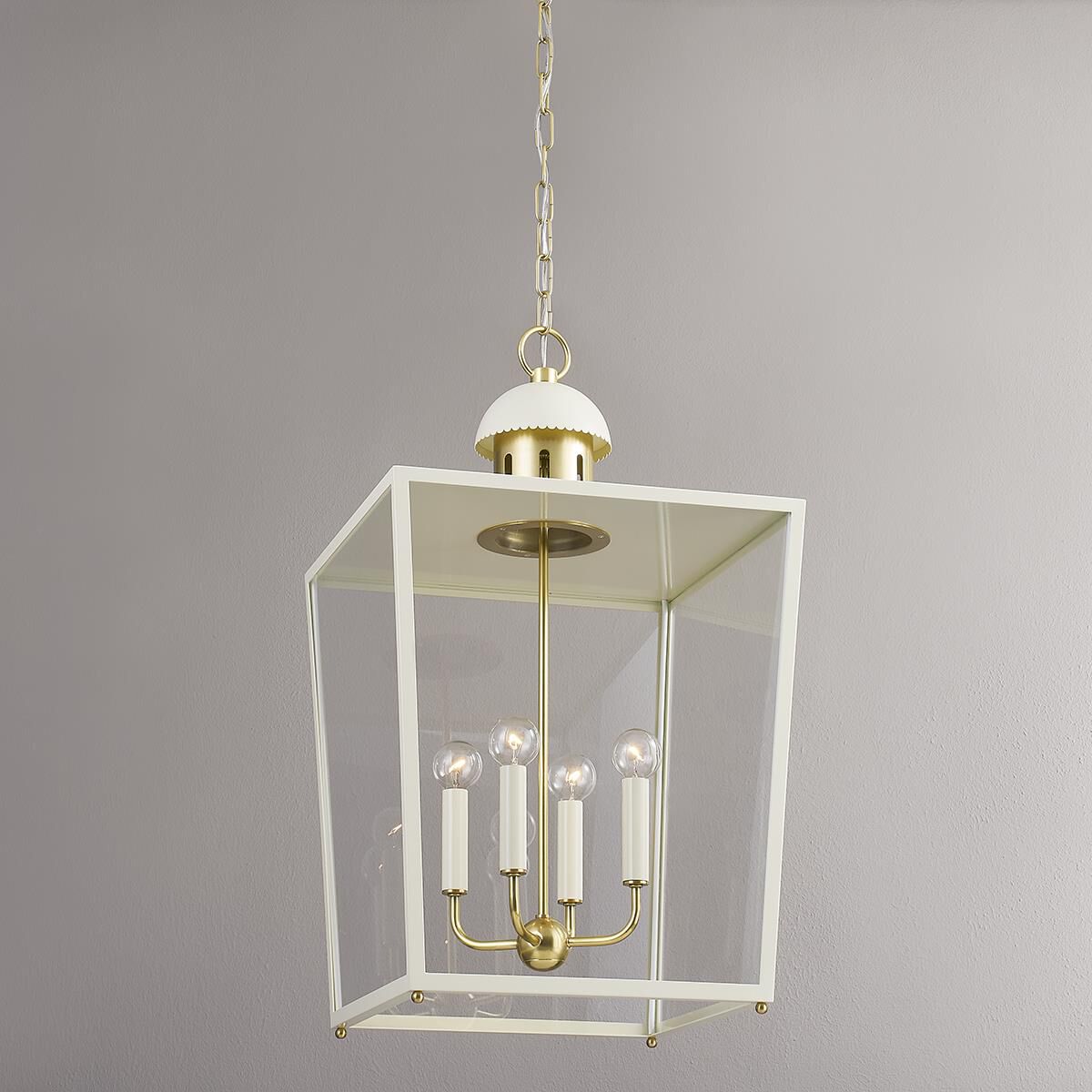 Shown in Aged Brass and Soft Cream finish and Clear glass