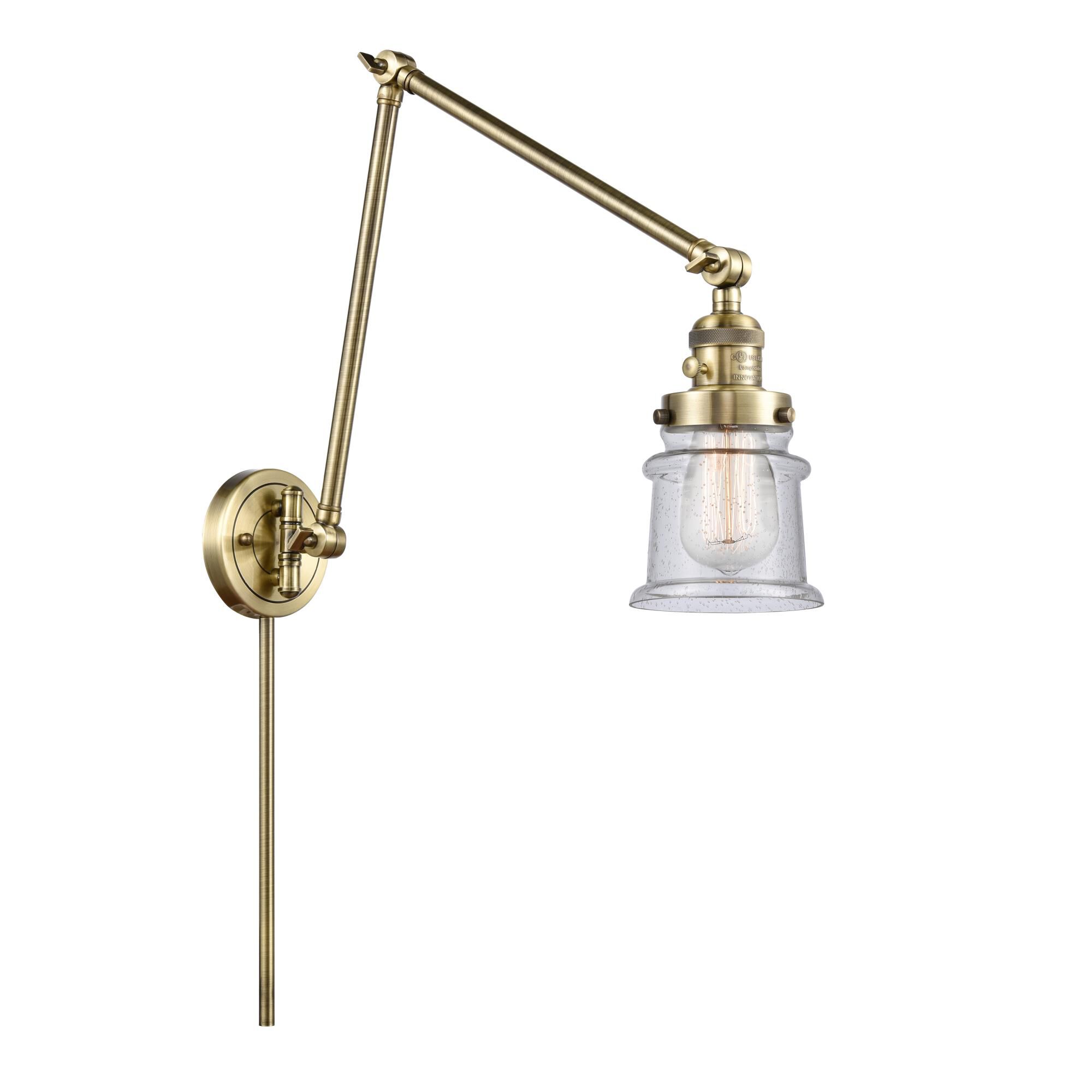 Shown in Antique Brass finish and Seedy Canton glass