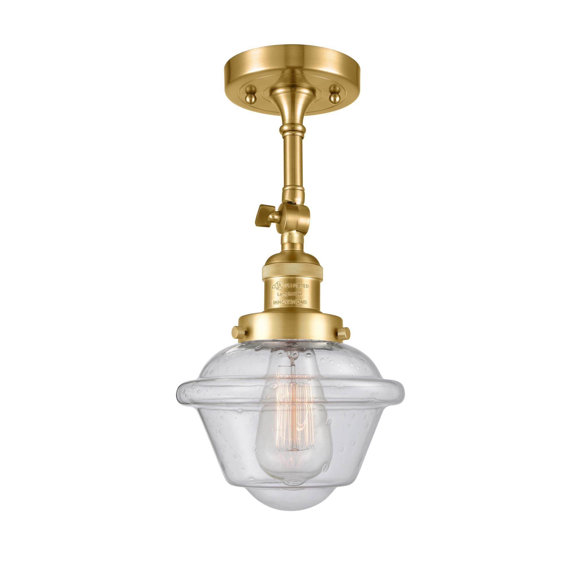 Shown in Satin Gold finish and Seedy glass and None accent