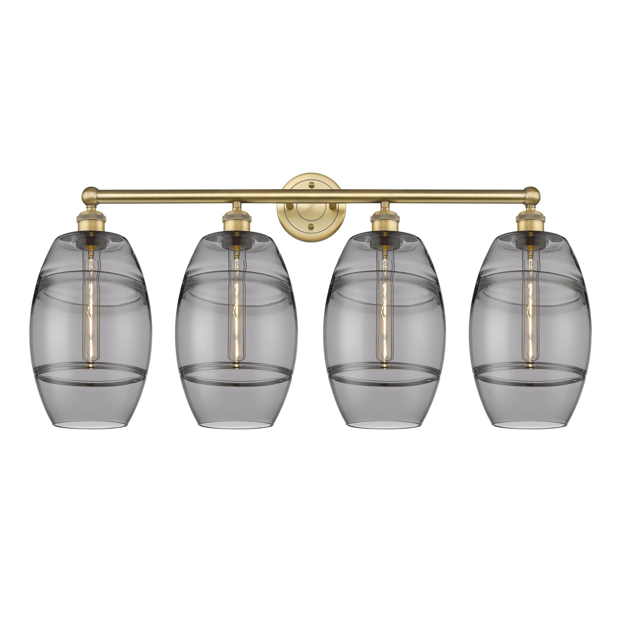 Shown in Brushed Brass finish and Light Smoke glass