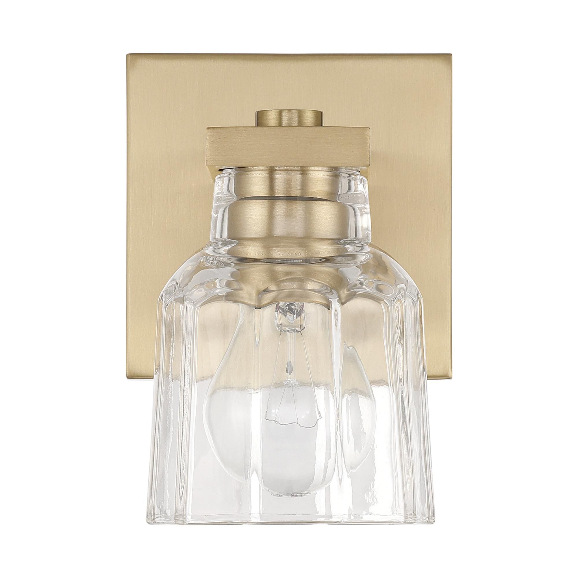 Shown in Champagne Gold finish and Clear Ribbed glass