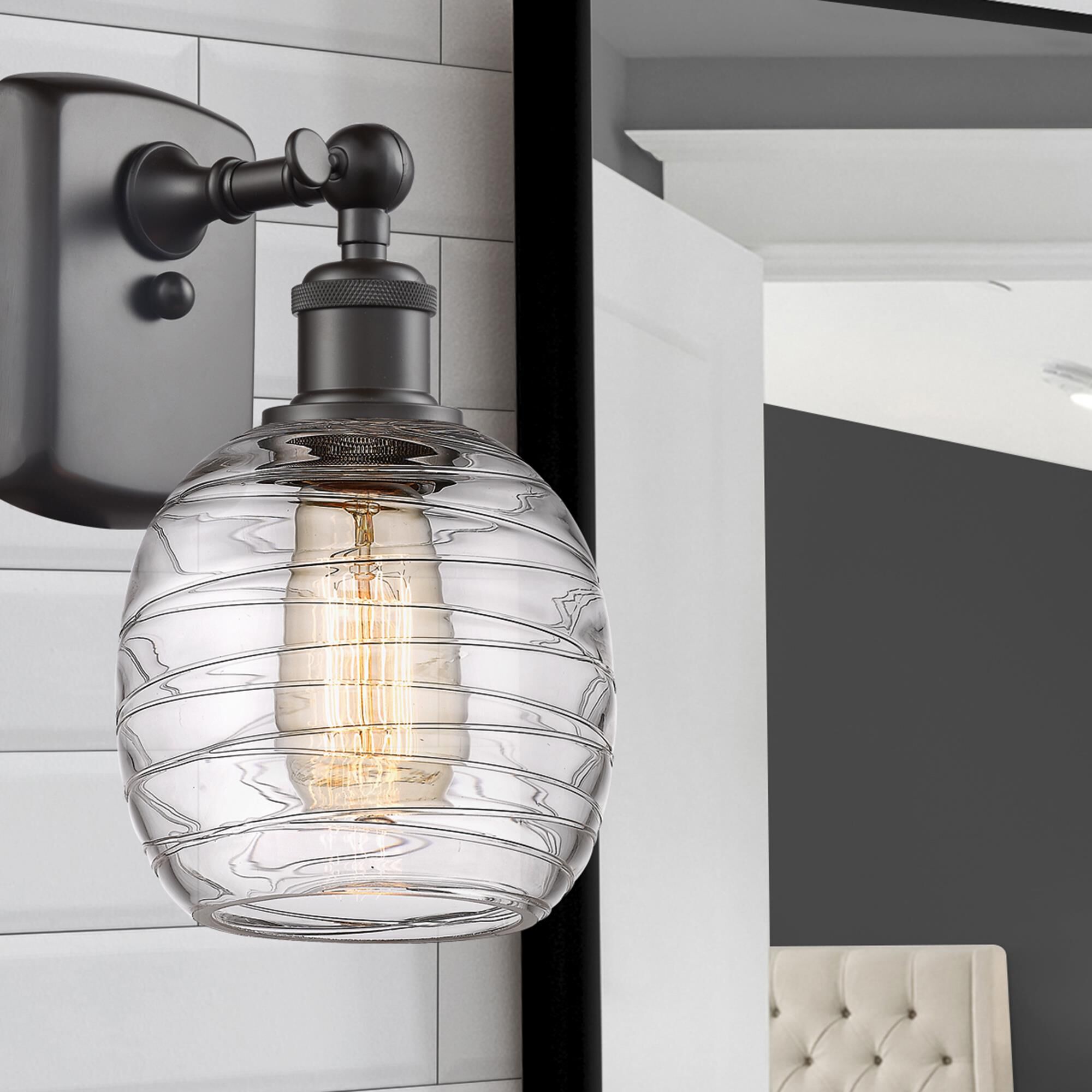 Shown in Oil Rubbed Bronze finish and Deco Swirl glass