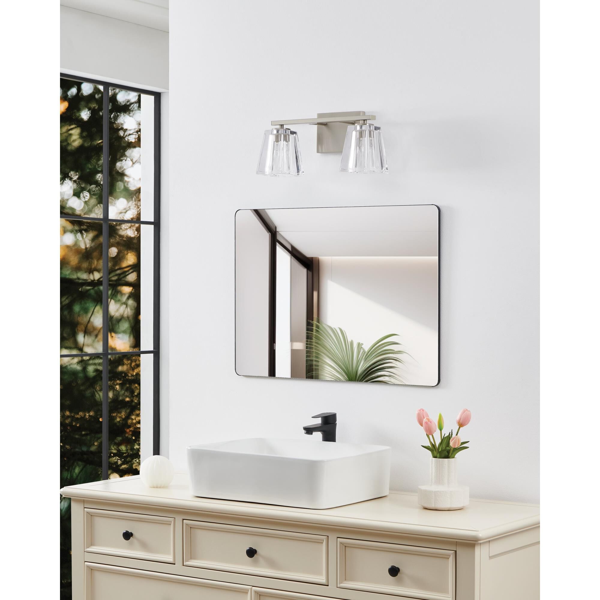 Shown in Brushed Nickel finish and Clear Pressed glass