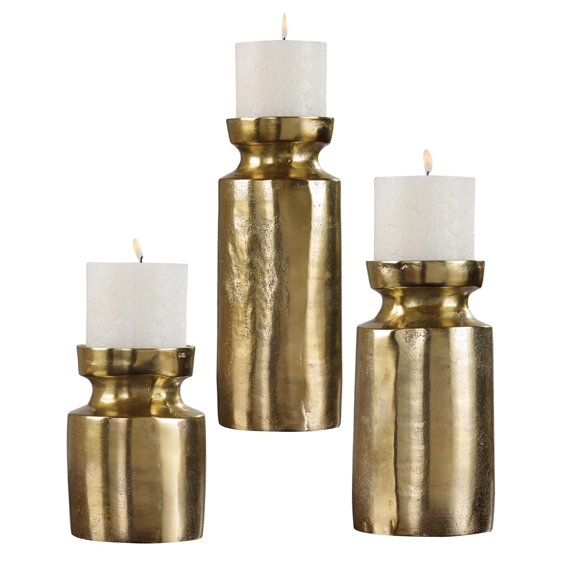 Shown in Set Of Three, Textured Cast Aluminum Candleholders Feature An Antiqued Brass Finish And Completed Wi finish