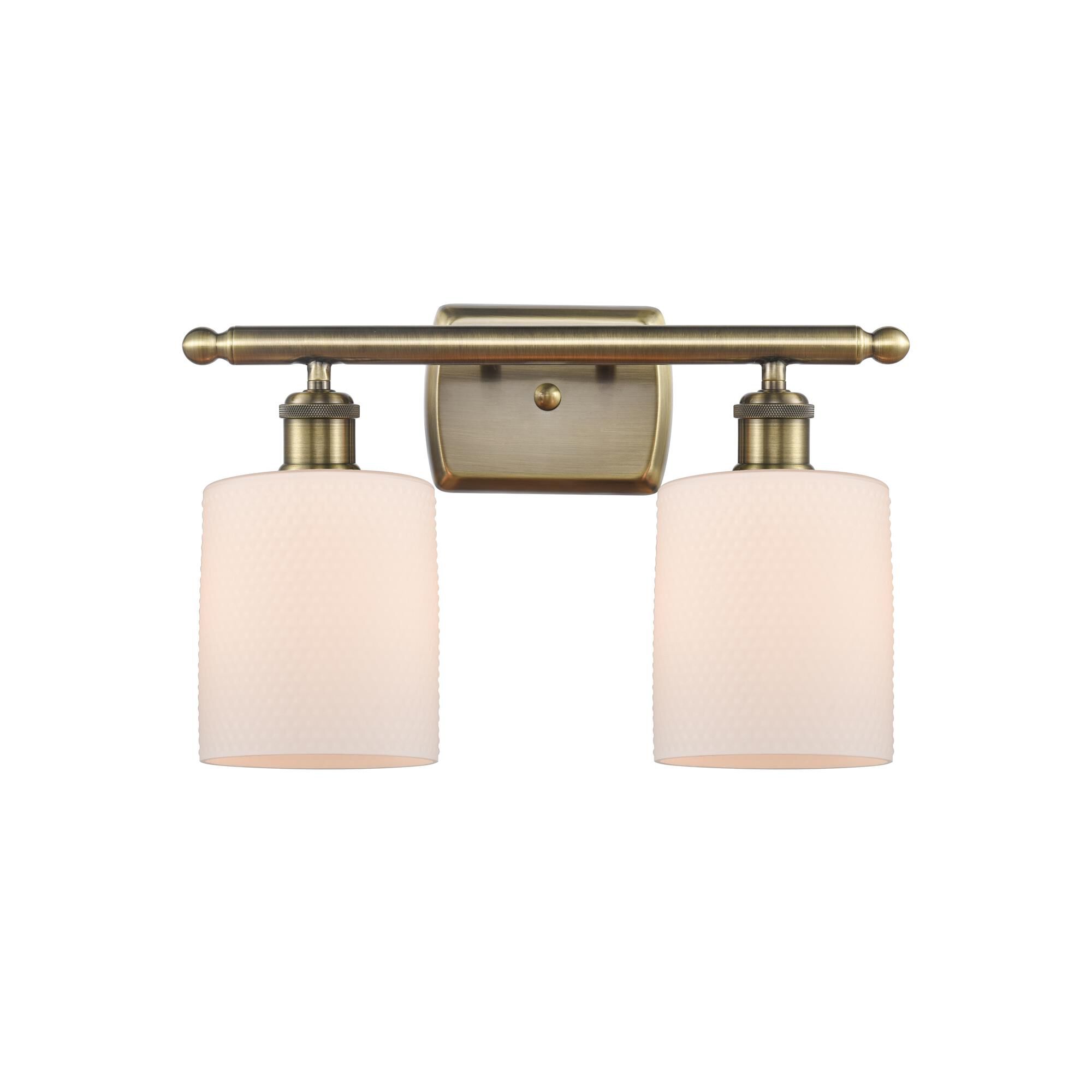 Shown in Antique Brass finish and Matte White Cobbleskill glass and None shade