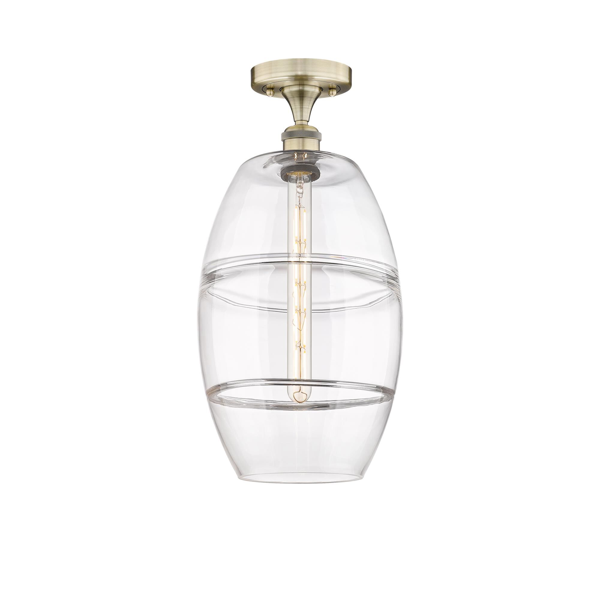 Shown in Antique Brass finish and Clear glass