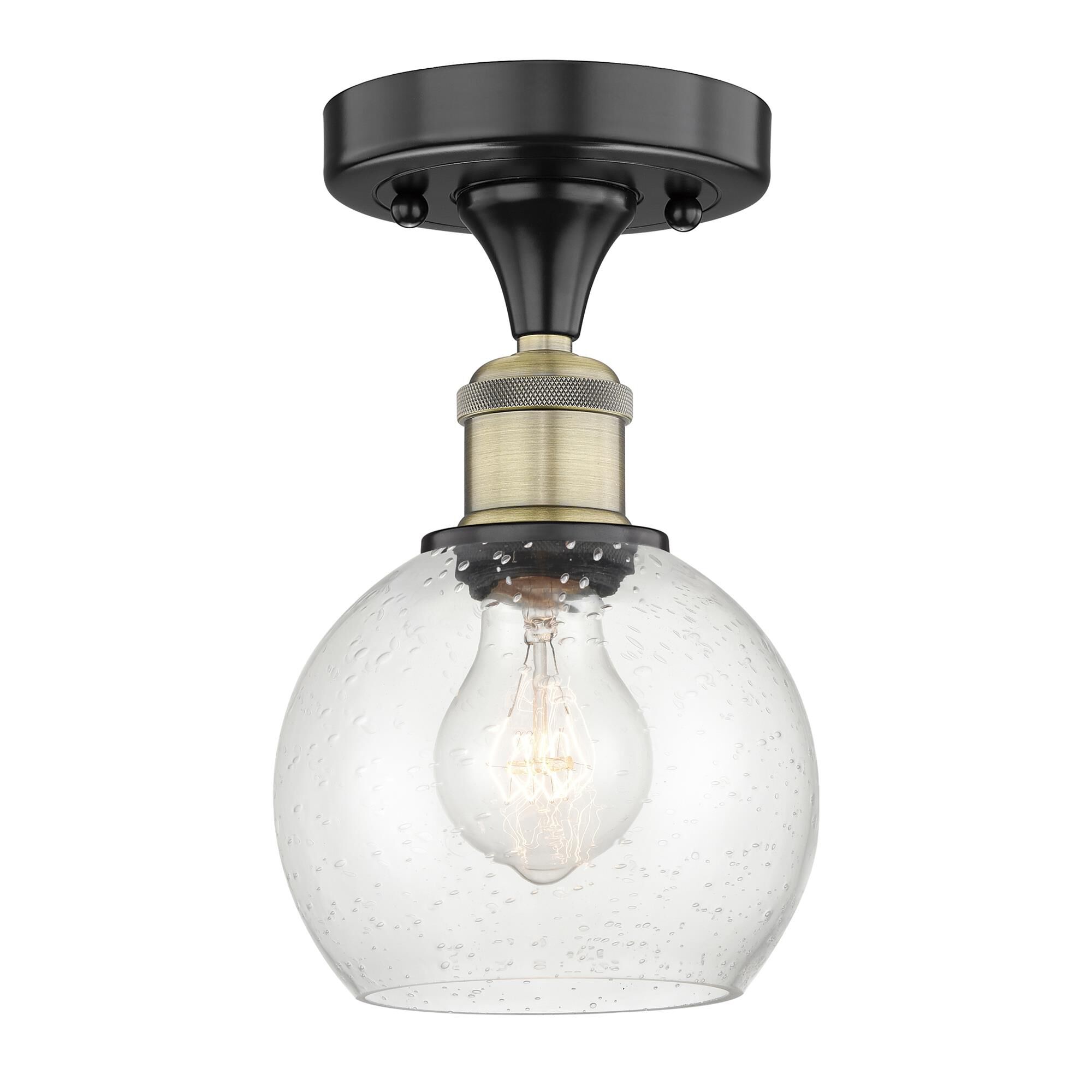 Shown in Black Antique Brass finish and Seedy glass