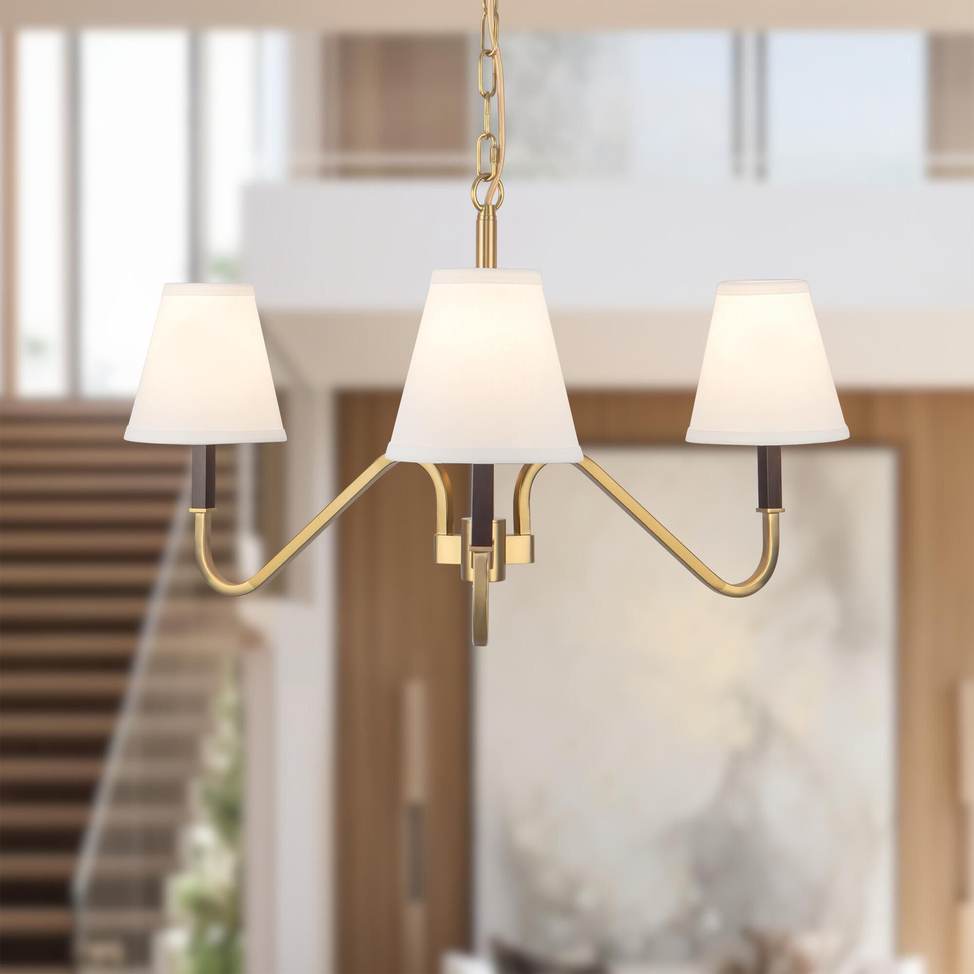 Shown in Brushed Gold finish and White Linen shade