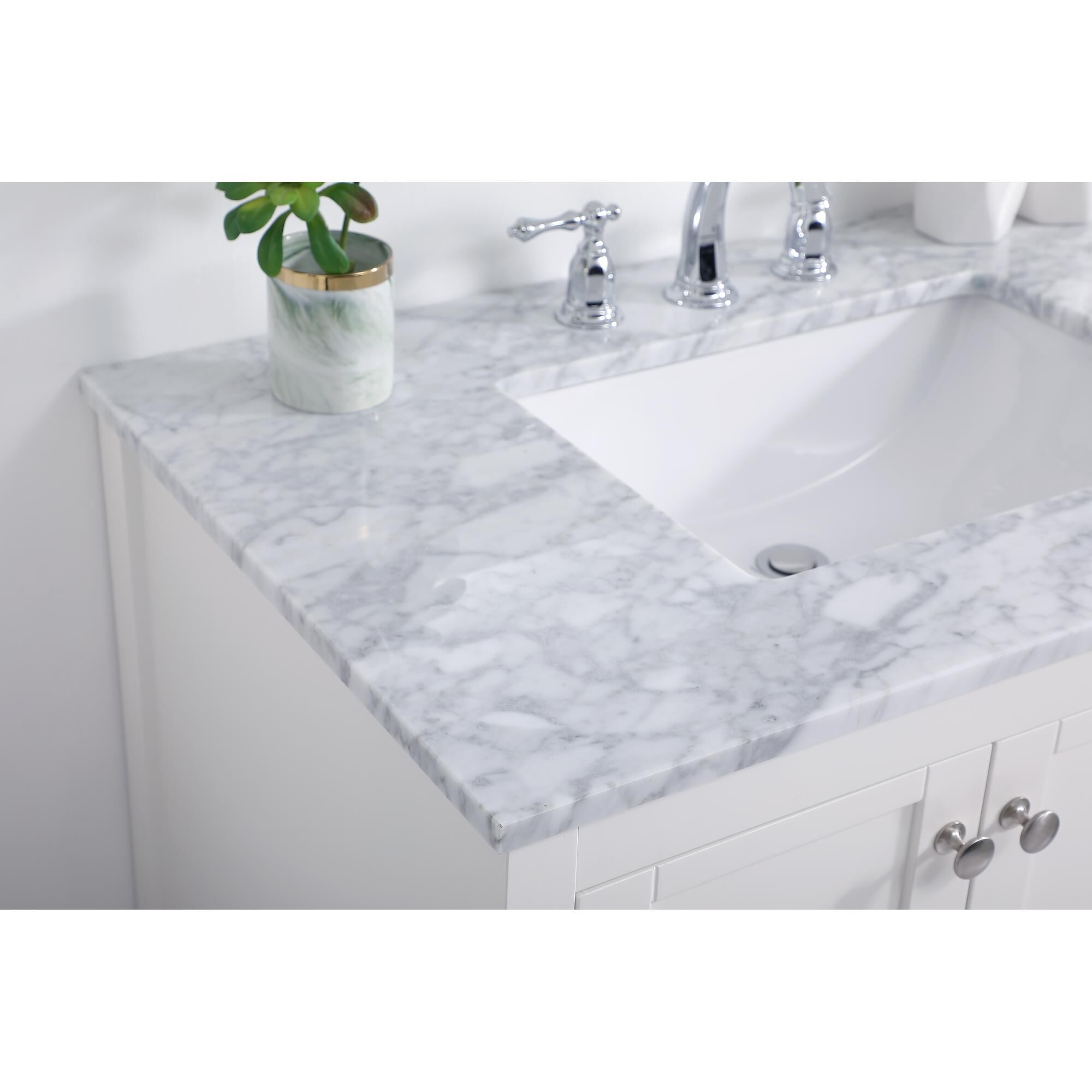 Shown in White And Brushed Nickel With Carrara White Marble finish
