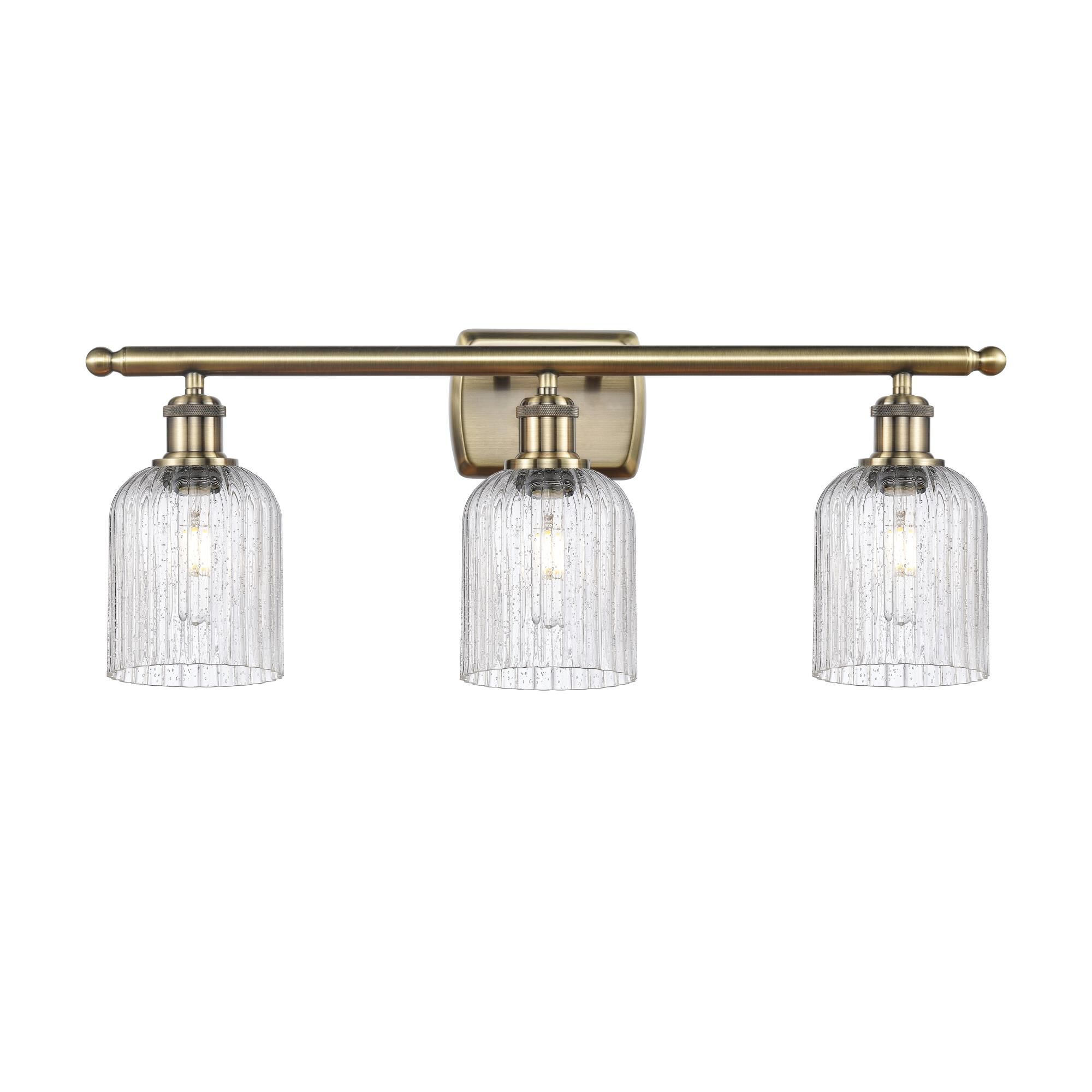 Shown in Antique Brass finish and Seedy shade