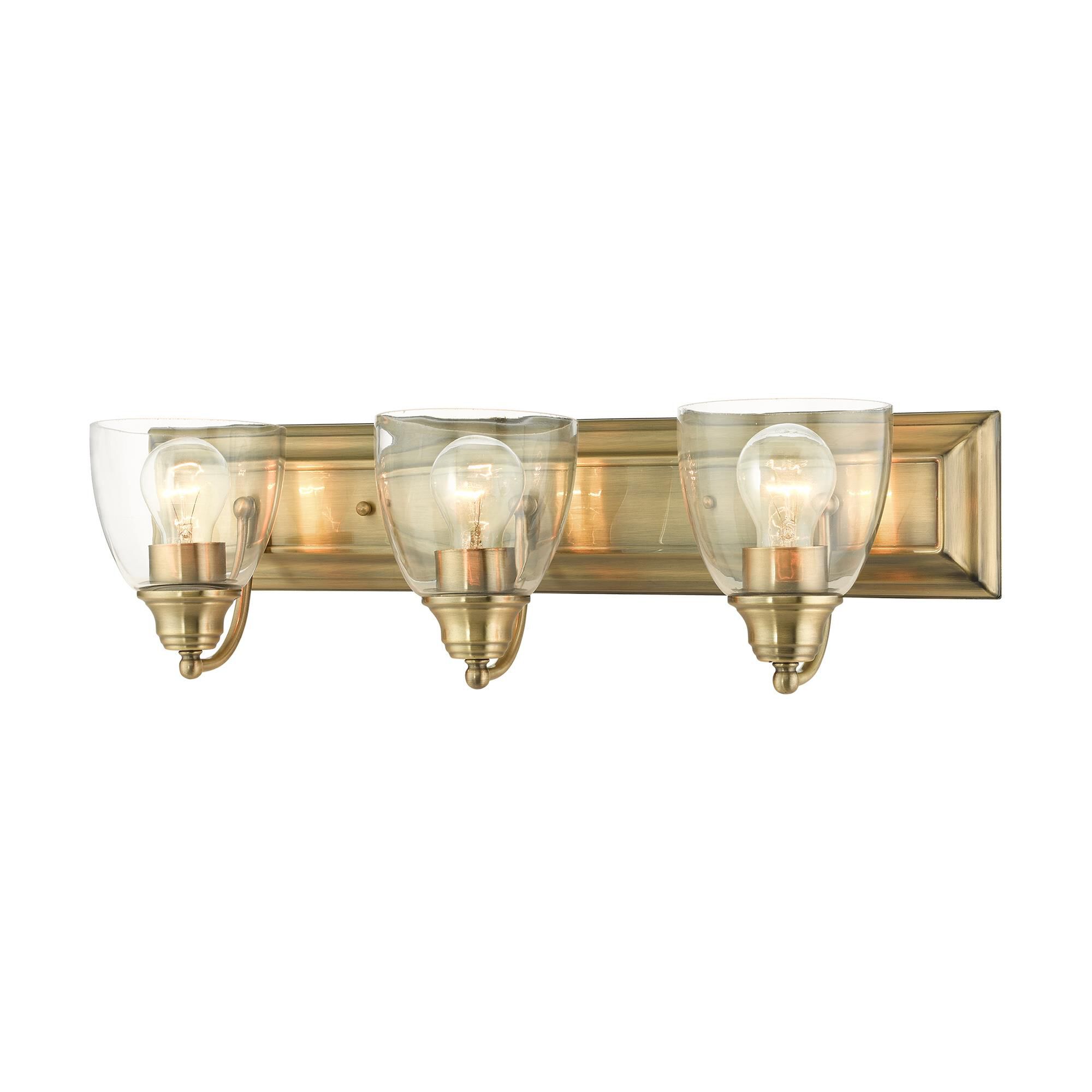 Shown in Antique Brass finish and Hand Blown Clear glass