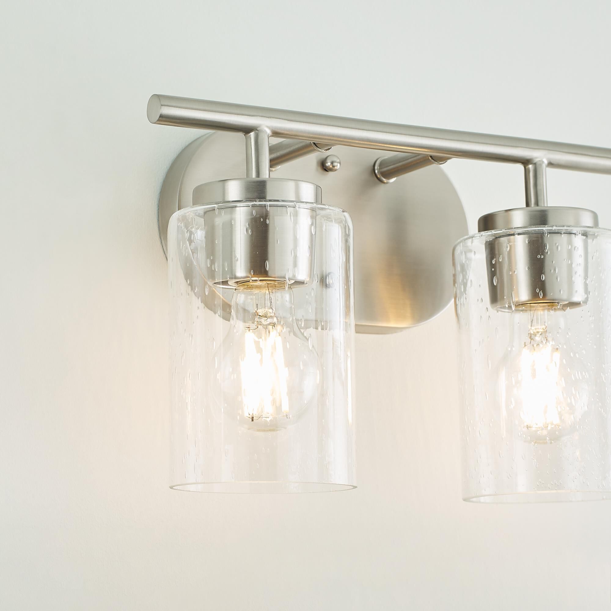 Shown in Brushed Nickel finish and Clear Seeded glass