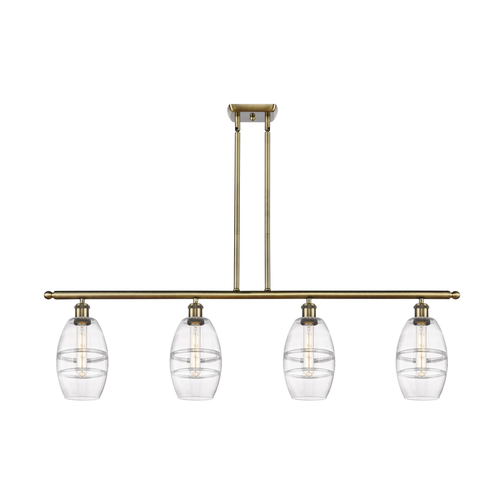 Shown in Antique Brass finish and Clear glass