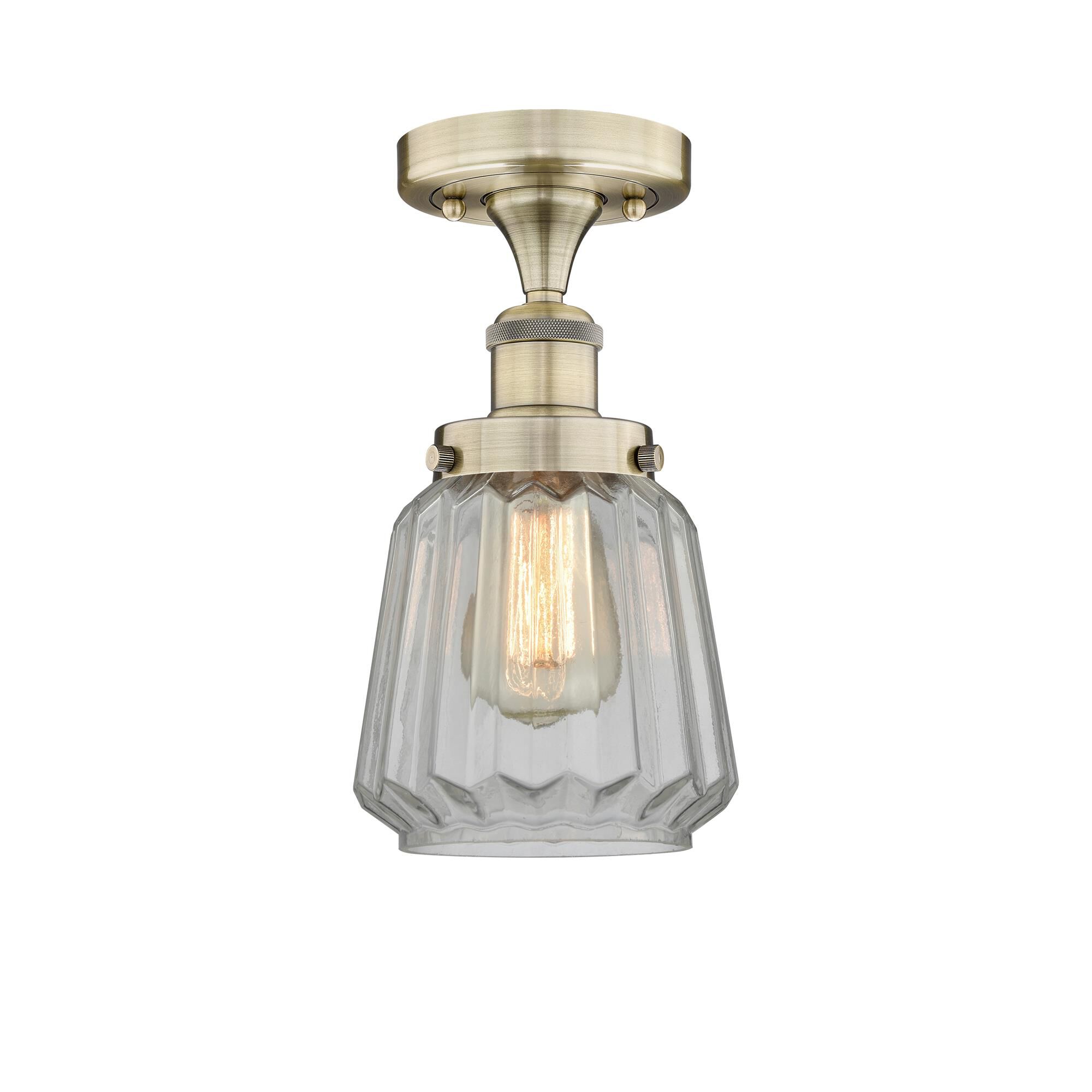 Shown in Antique Brass finish and Clear glass