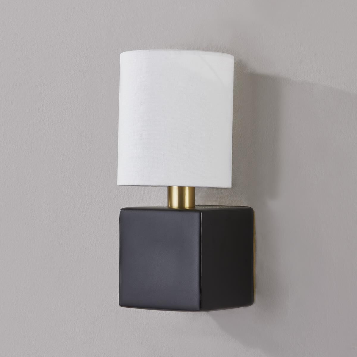 Shown in Aged Brass and Satin Black finish and White Linen shade