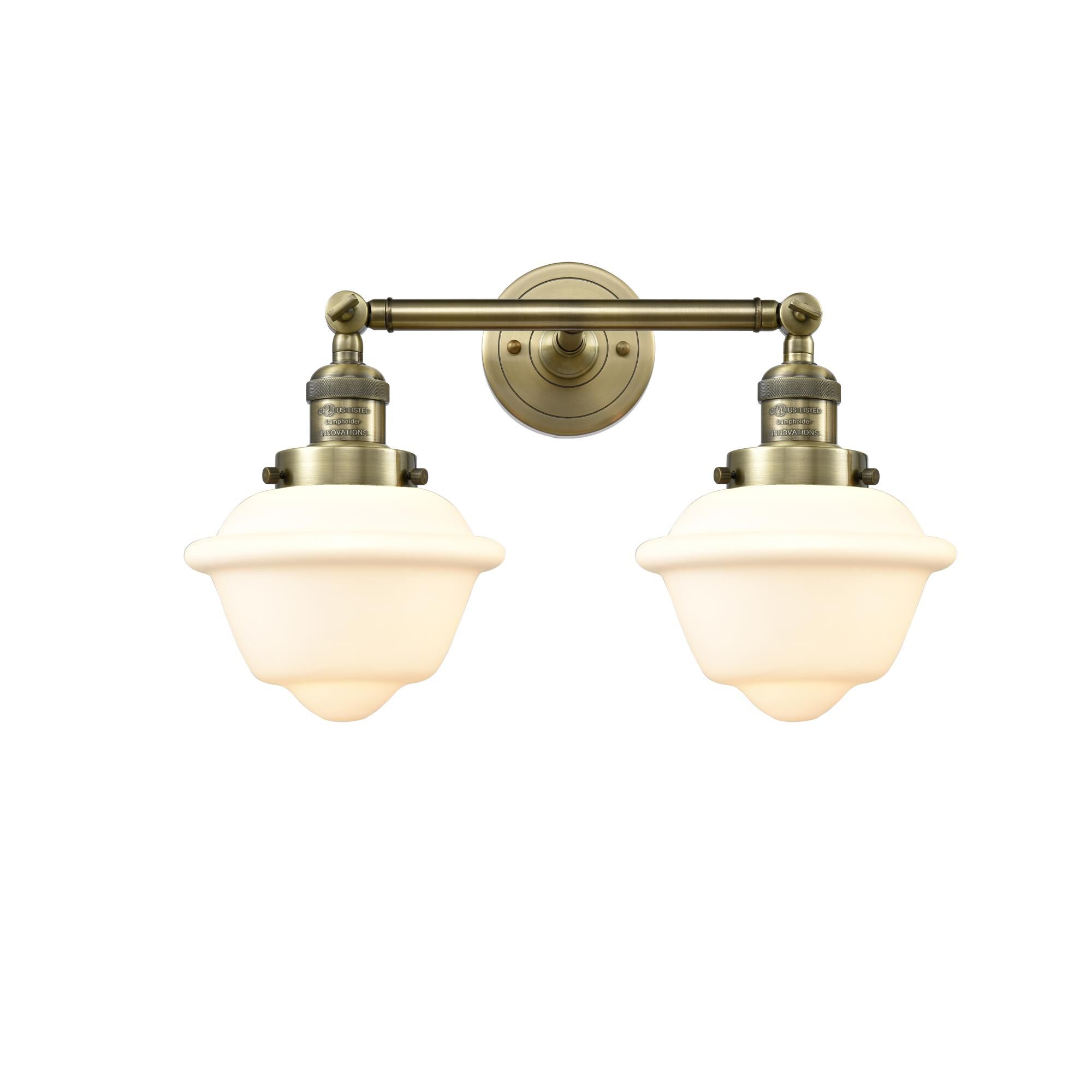 Shown in Antique Brass finish and Matte White Cased glass
