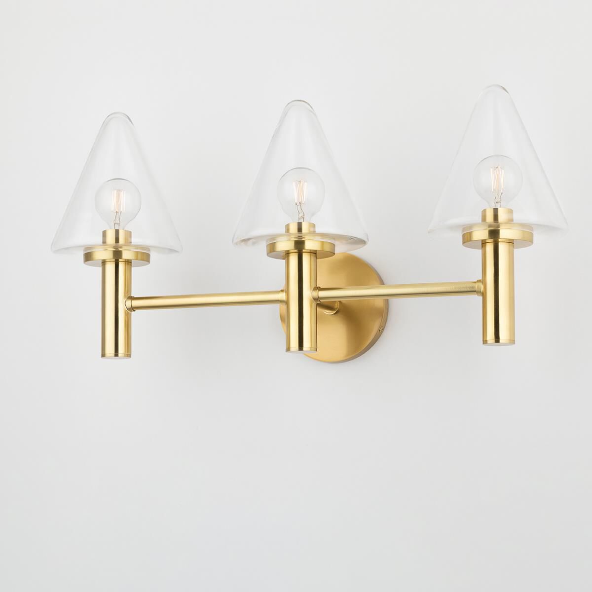 Shown in Aged Brass finish and White glass