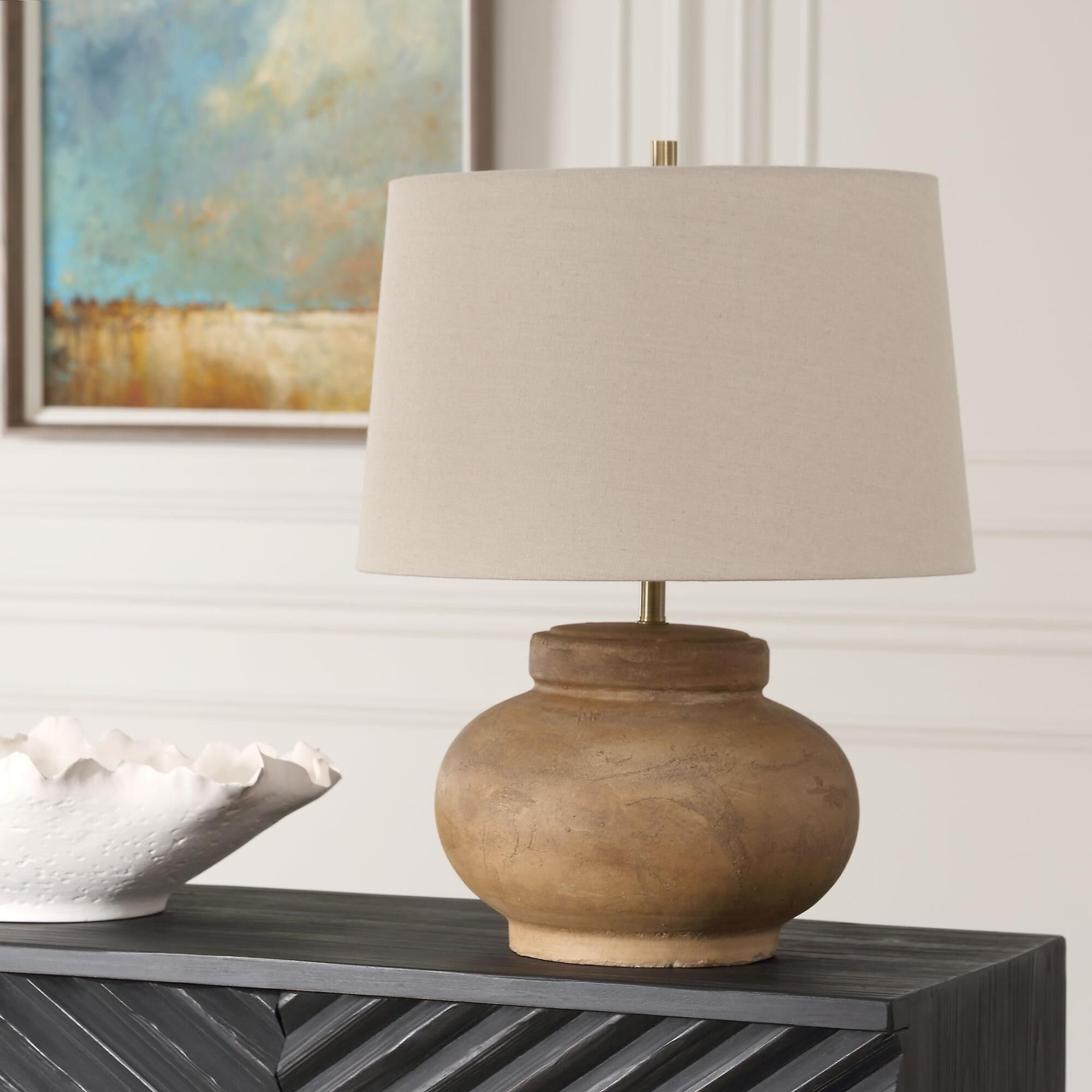 Shown in Crafted With A Distressed Terracotta Base, The Urbino Table Lamp Exudes Warmth And Character With It finish and Round Hardback  Rolled Edge shade