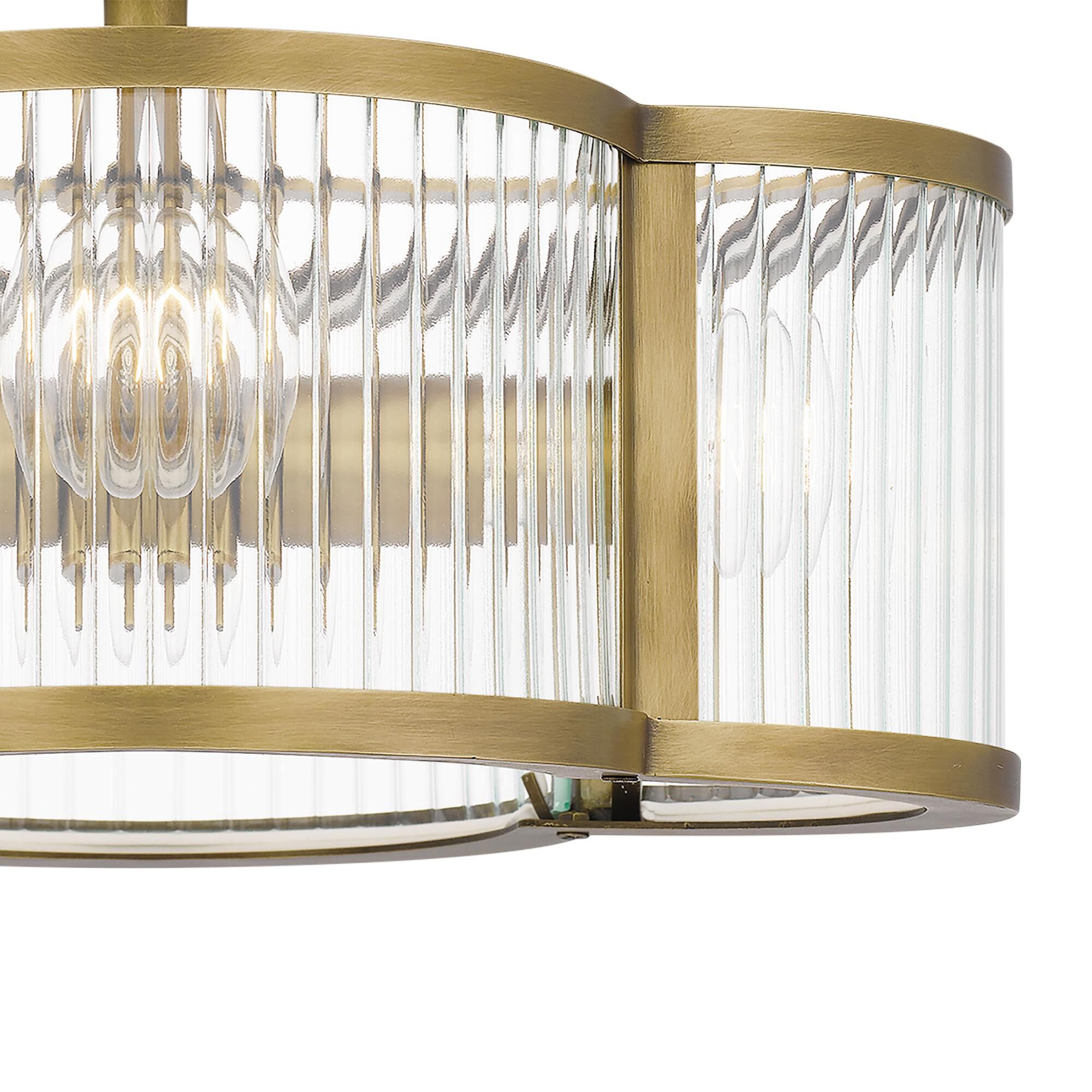 Shown in Weathered Brass finish and Clear Ribbed glass