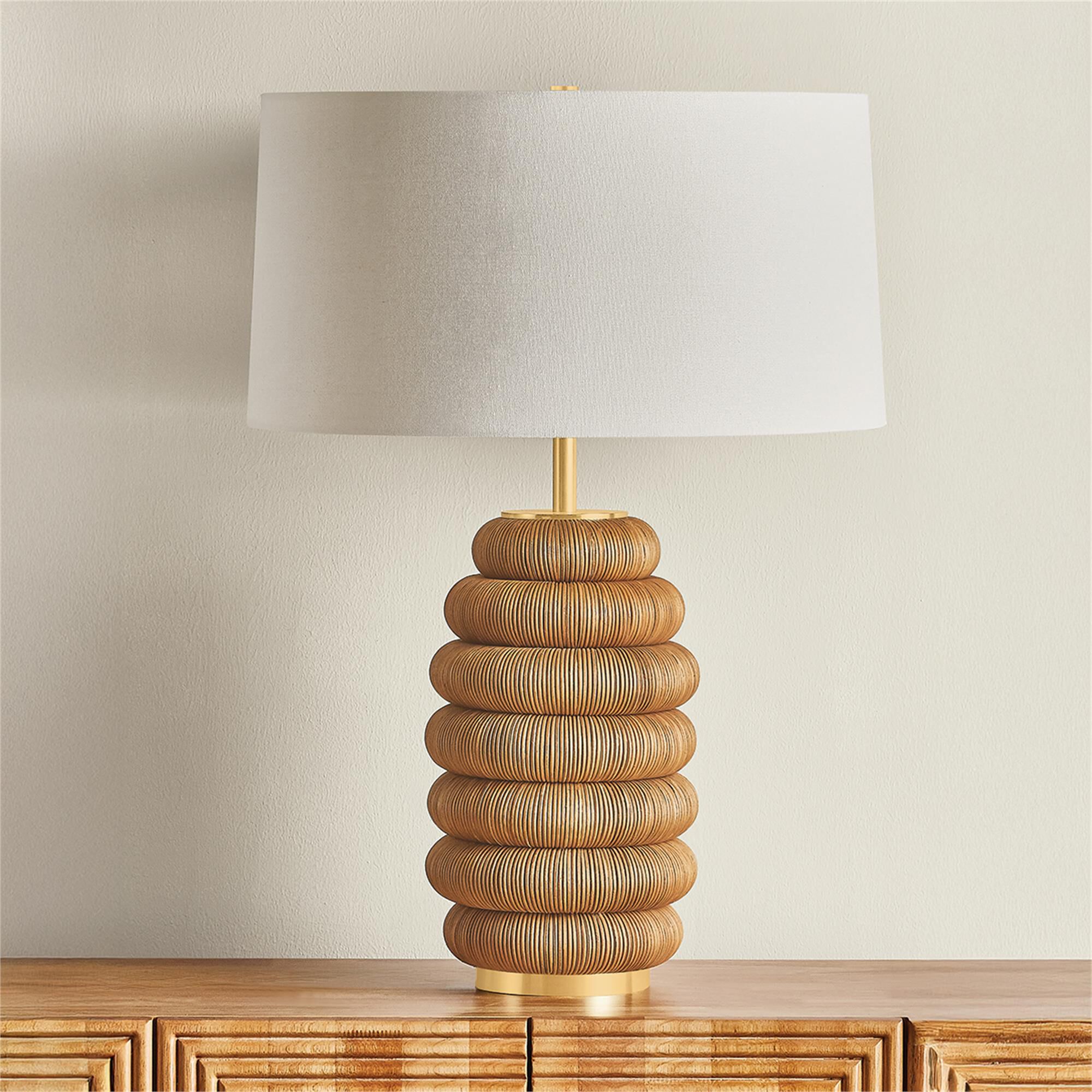 Shown in Aged Brass finish and White Linen shade