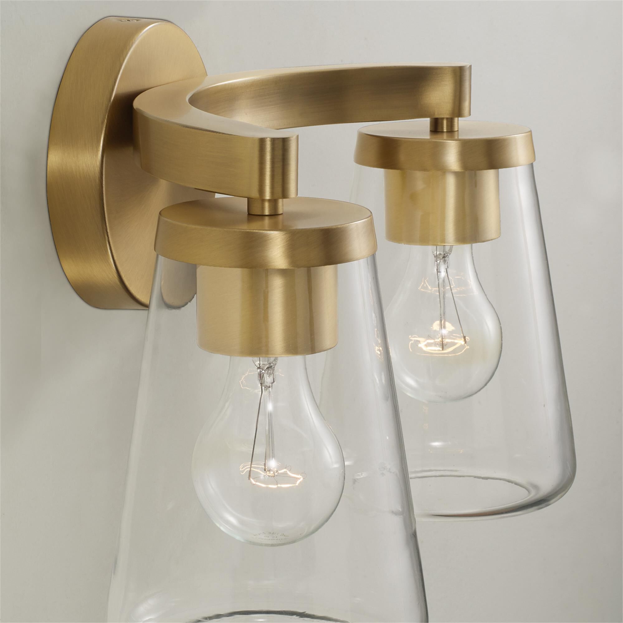 Shown in Aged Brass finish and Clear glass