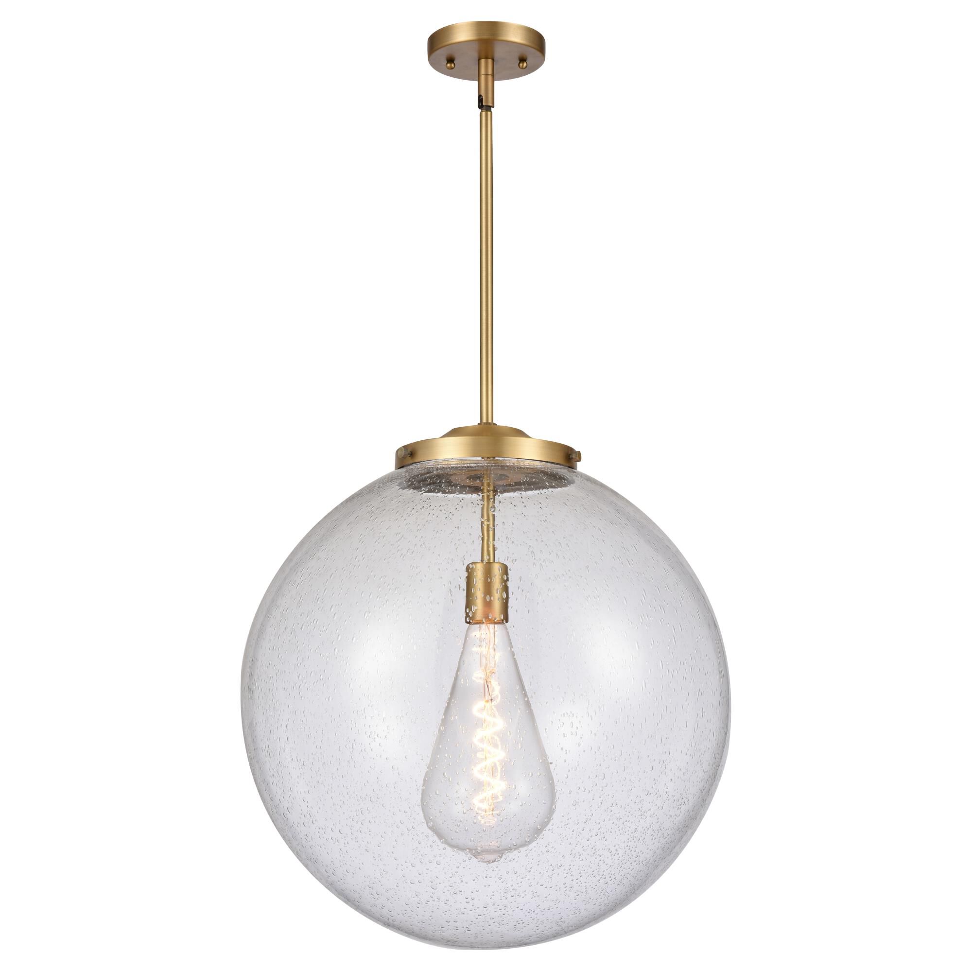 Shown in Brushed Brass finish and Seedy Beacon glass