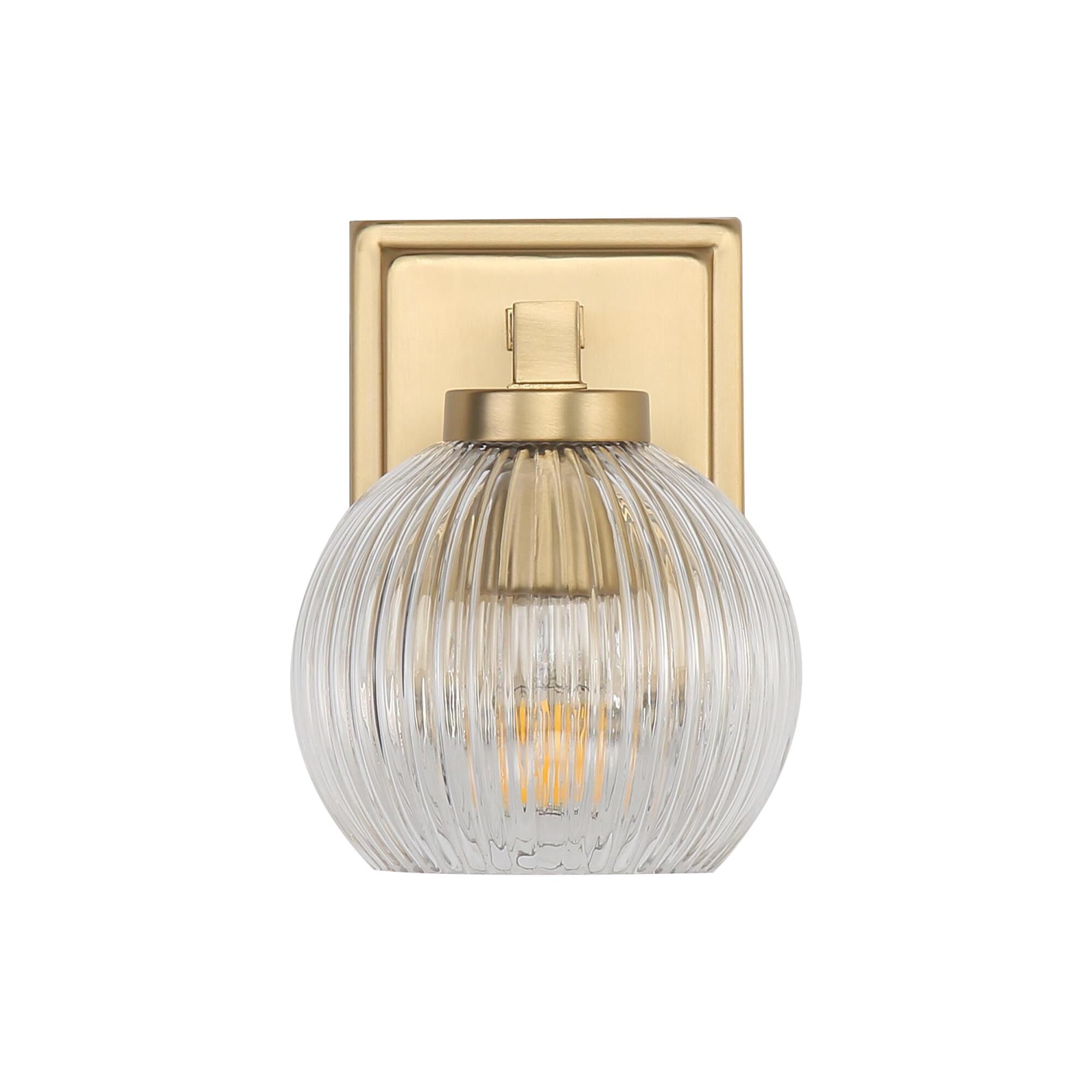 Shown in Brushed Champagne Bronze finish and Ribbed Clear Glass shade