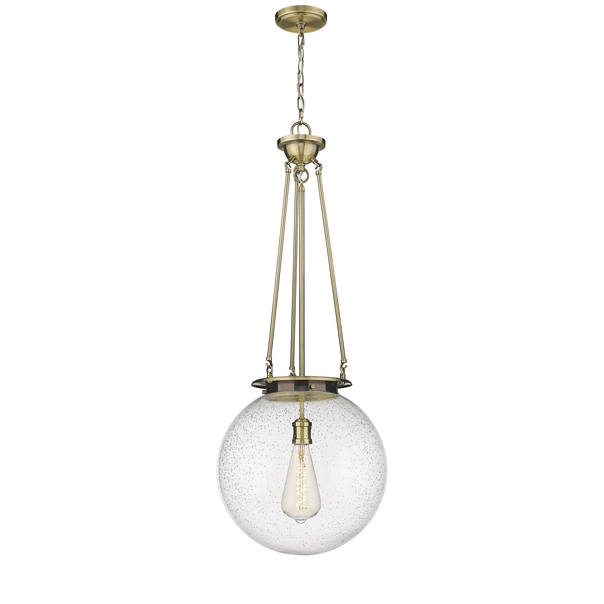 Shown in Antique Brass finish and Seedy glass