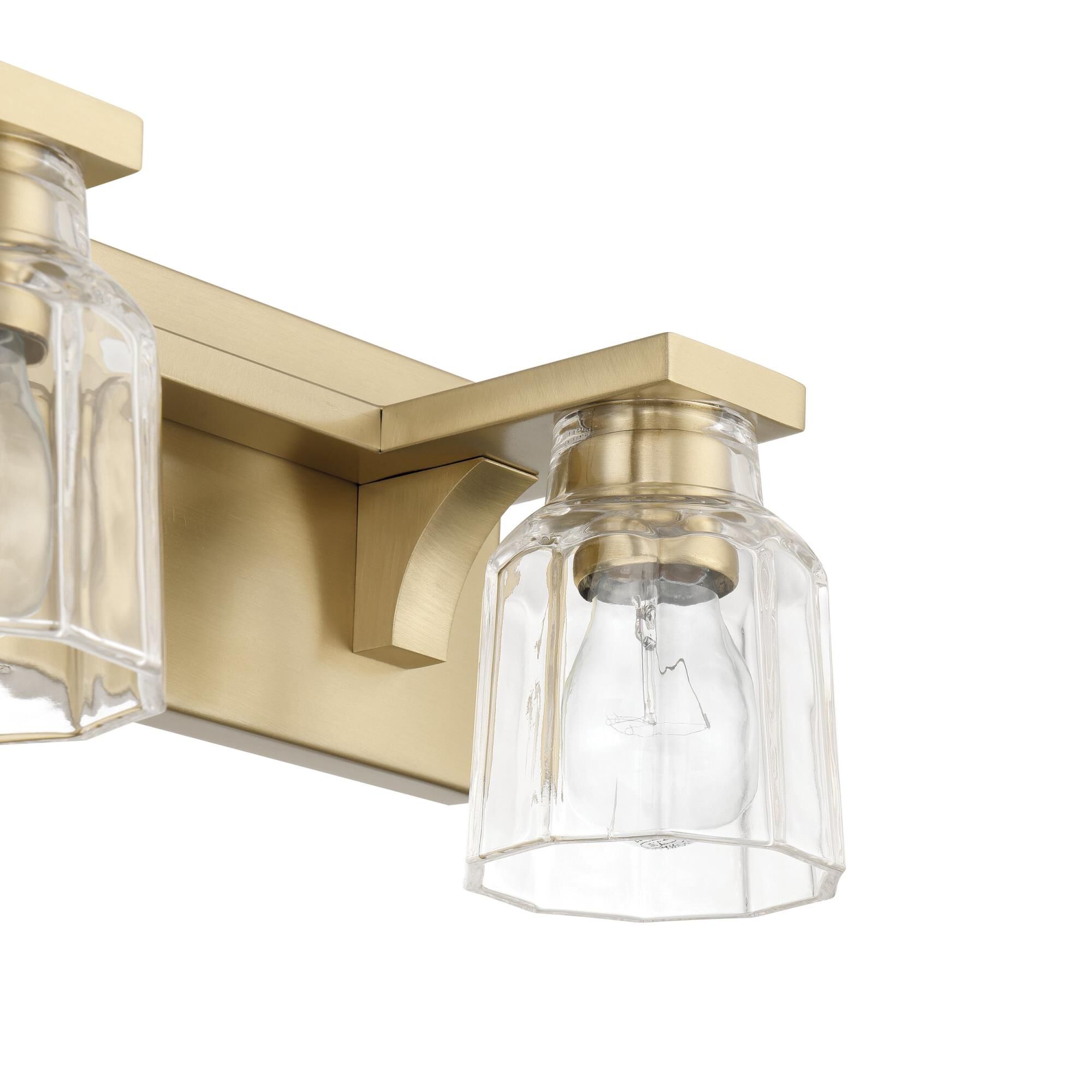 Shown in Champagne Gold finish and Clear Ribbed glass