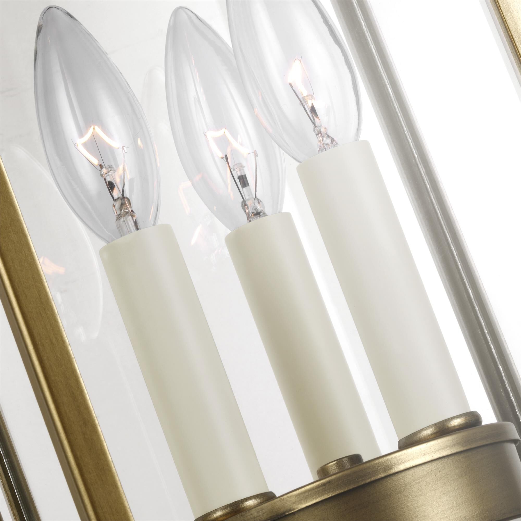 Shown in Painted Distressed Brass finish and Clear Panels glass