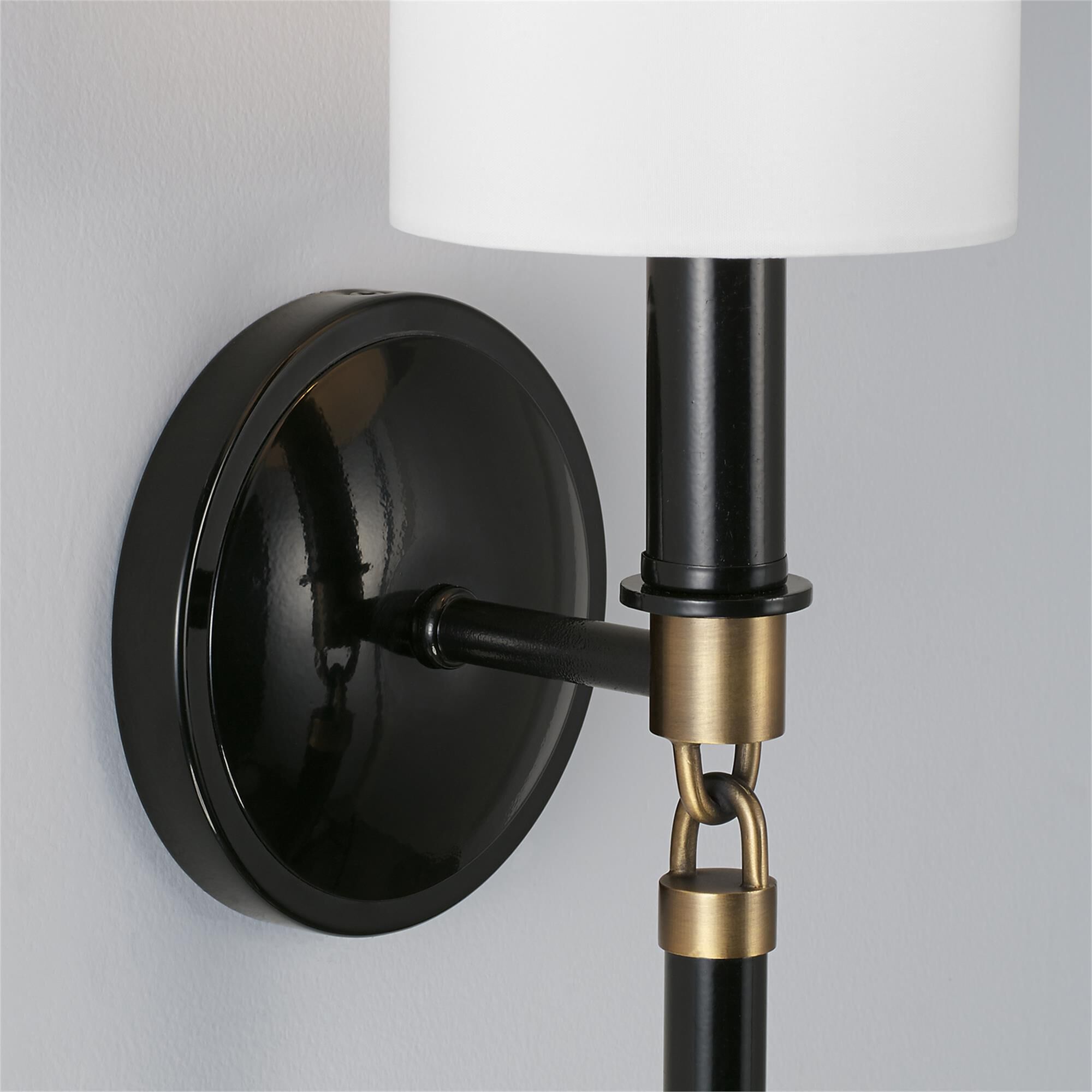 Shown in Glossy Black And Aged Brass finish and 700 glass and White Fabric Stay-Straight shade