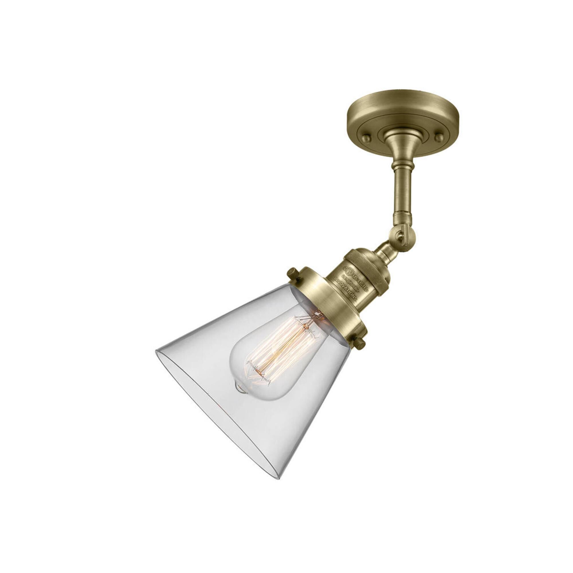 Shown in Antique Brass finish and Clear glass and None accent