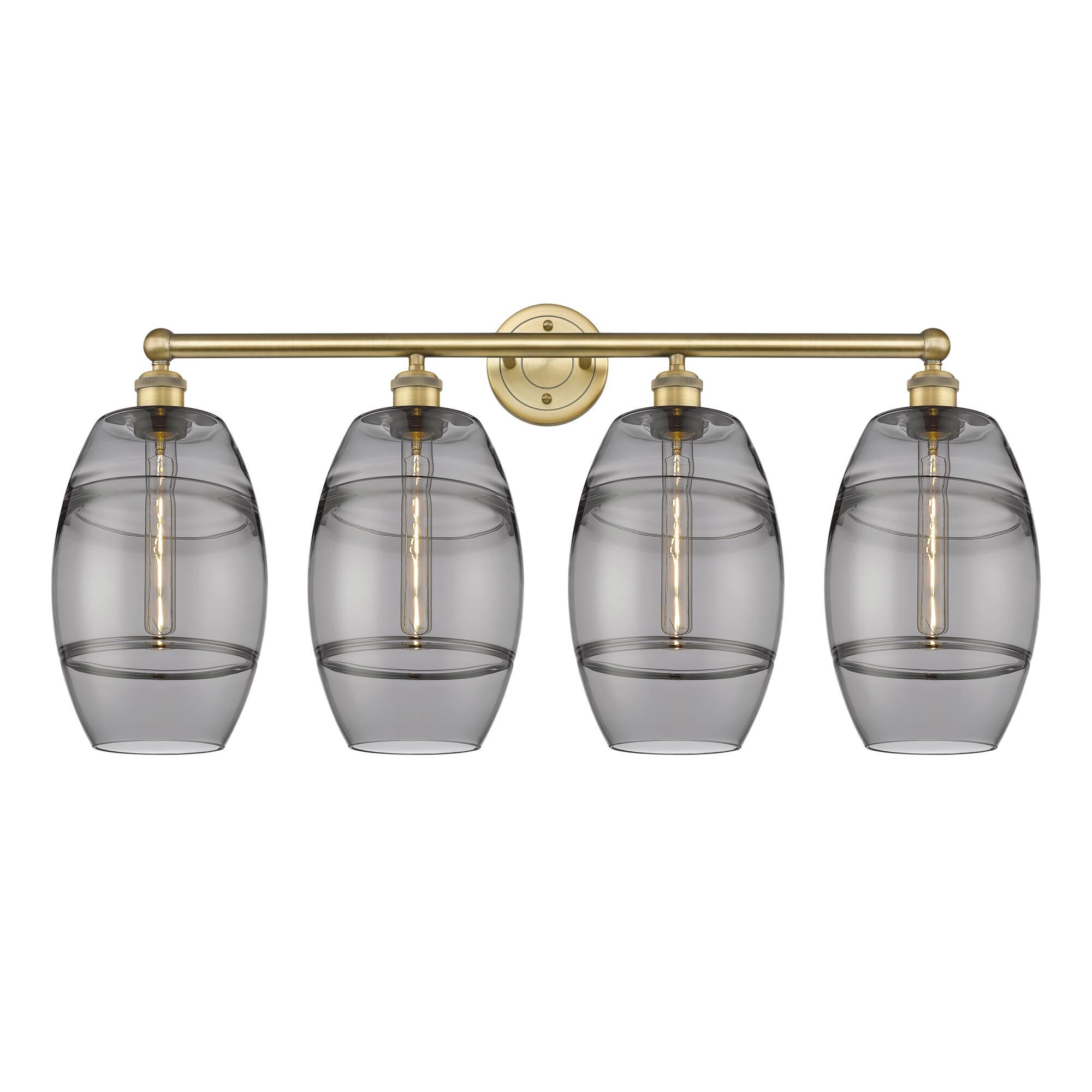 Shown in Brushed Brass finish and Light Smoke glass