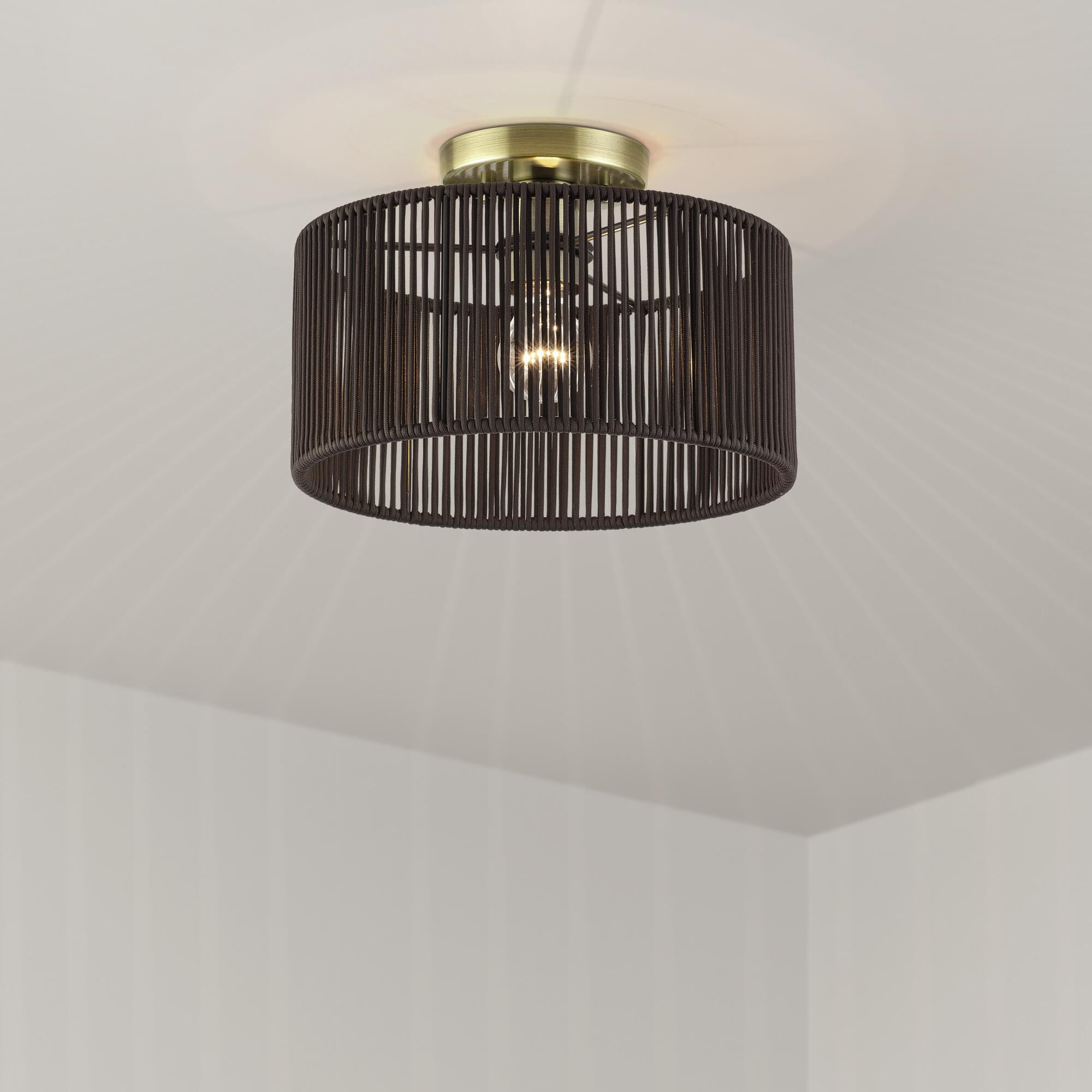 Shown in Antique Brass finish and Hand-Woven Dark Chocolate Color Polyester Rope shade