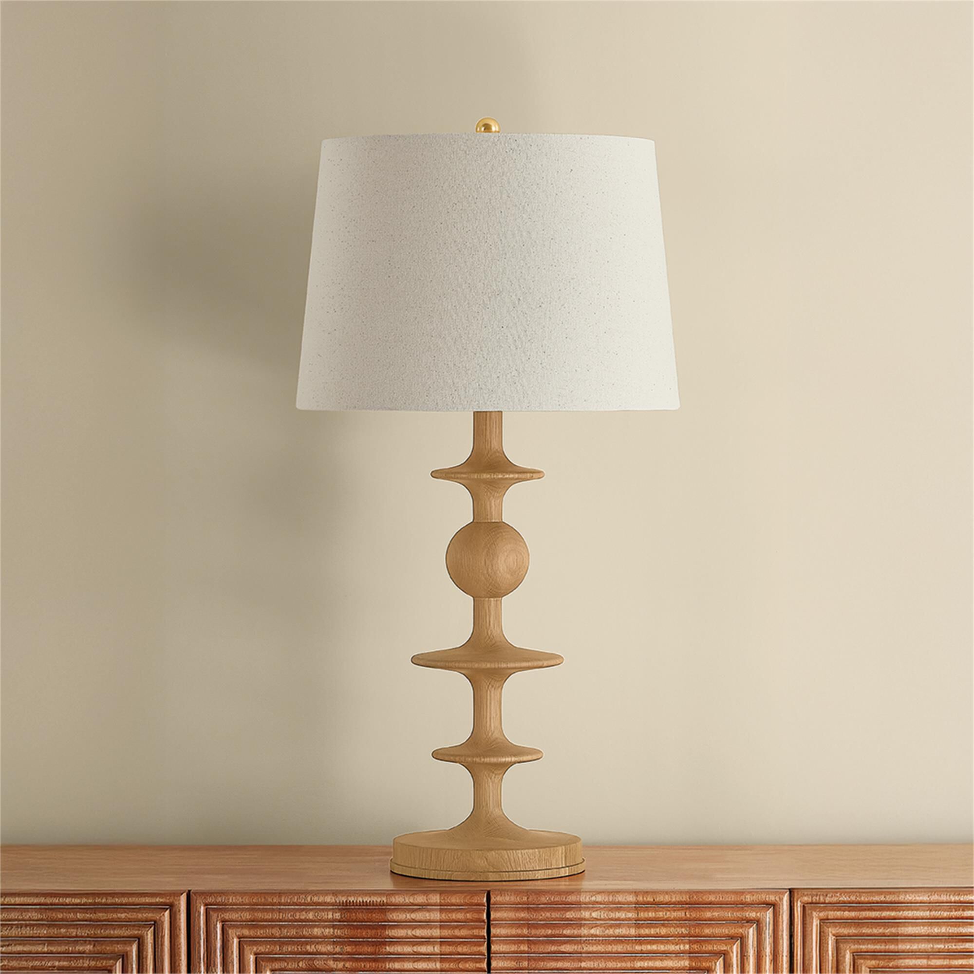Shown in Aged Brass finish and Wheat Linen shade