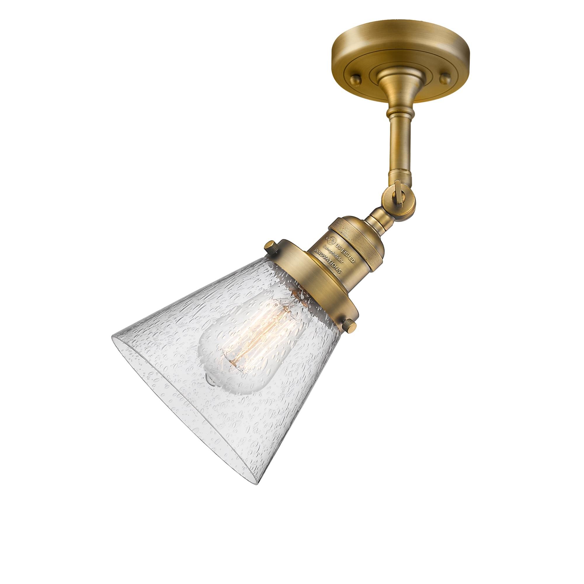 Shown in Brushed Brass finish and Seedy glass and None accent