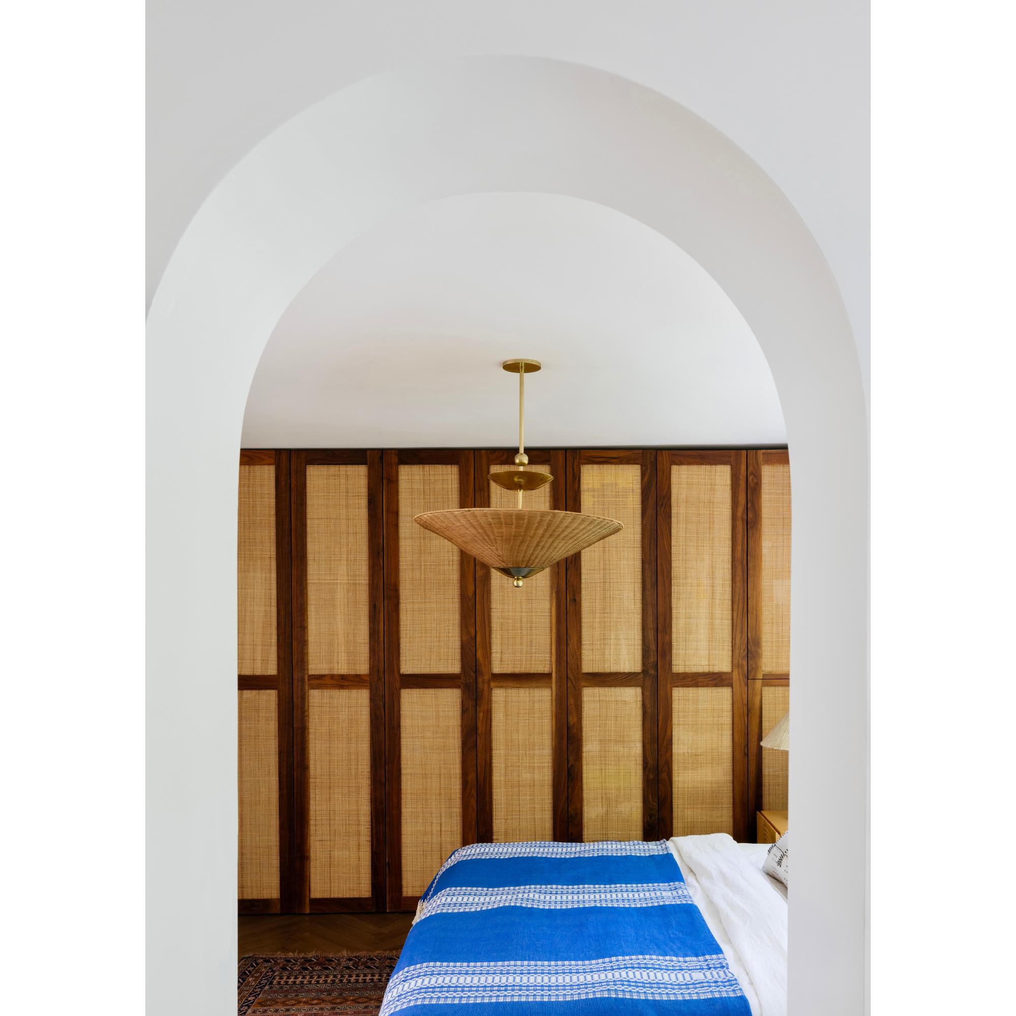 Shown in Aged Brass finish and Natural Woven shade