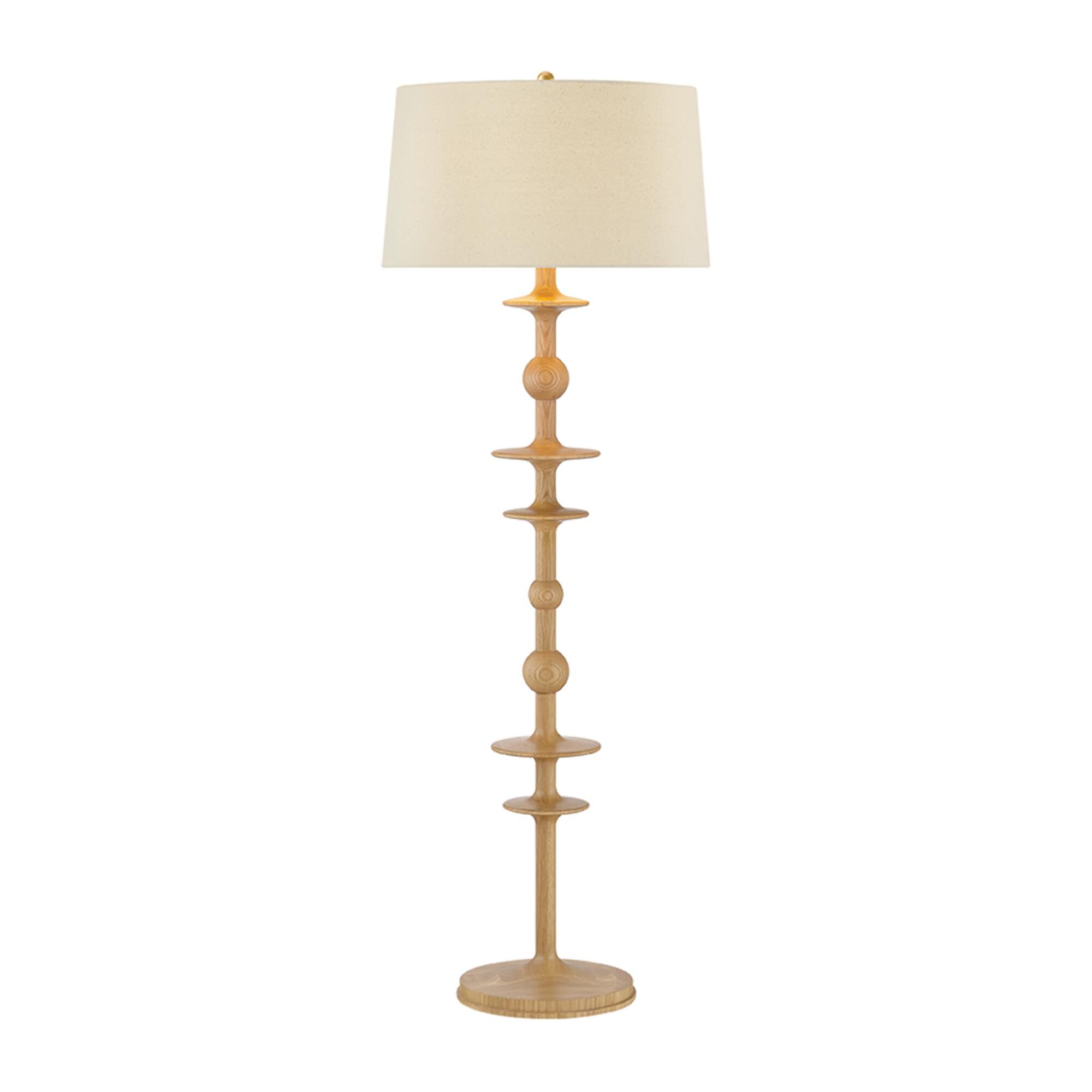 Shown in Aged Brass finish and Wheat Linen shade
