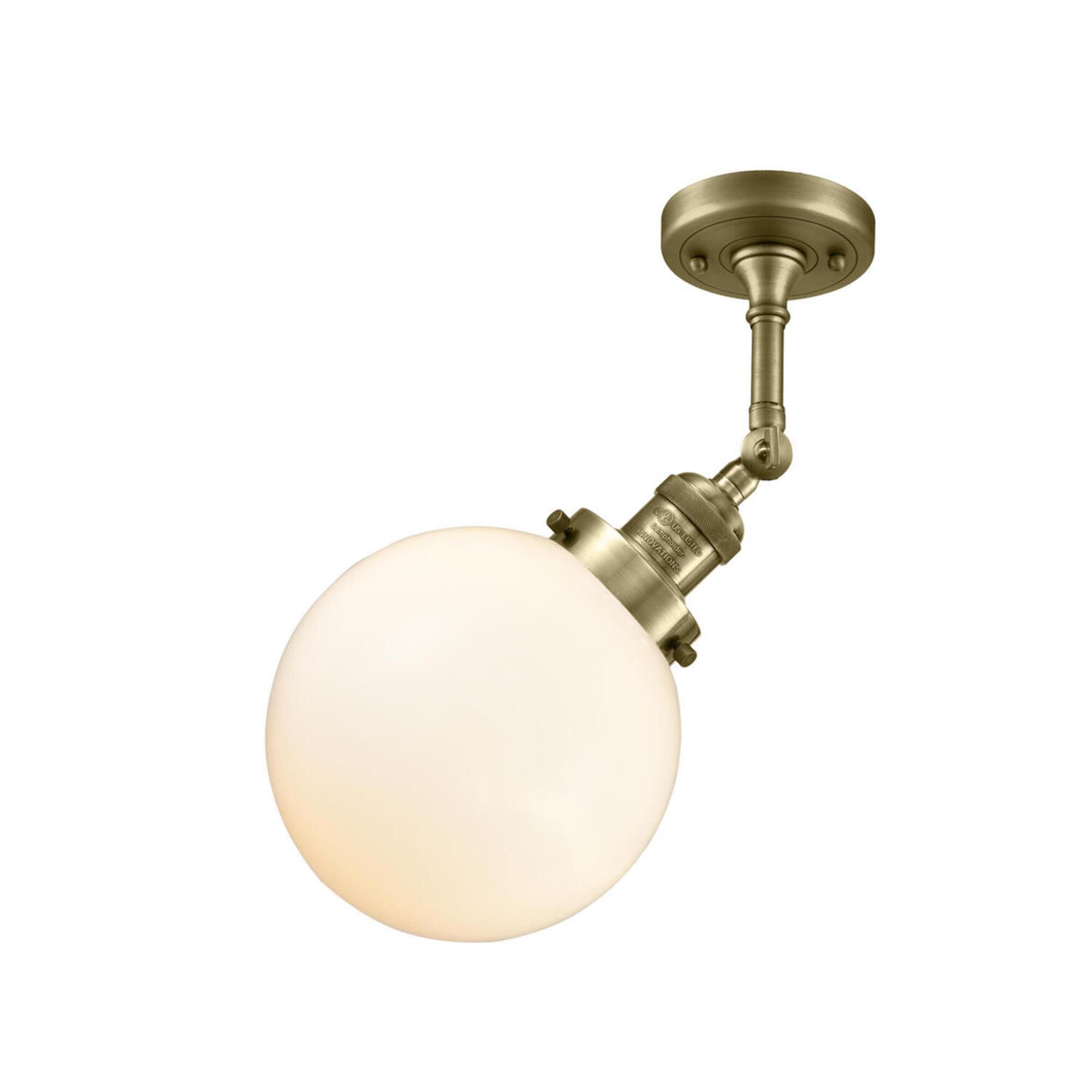 Shown in Antique Brass finish and Matte White Cased glass and No Accent accent