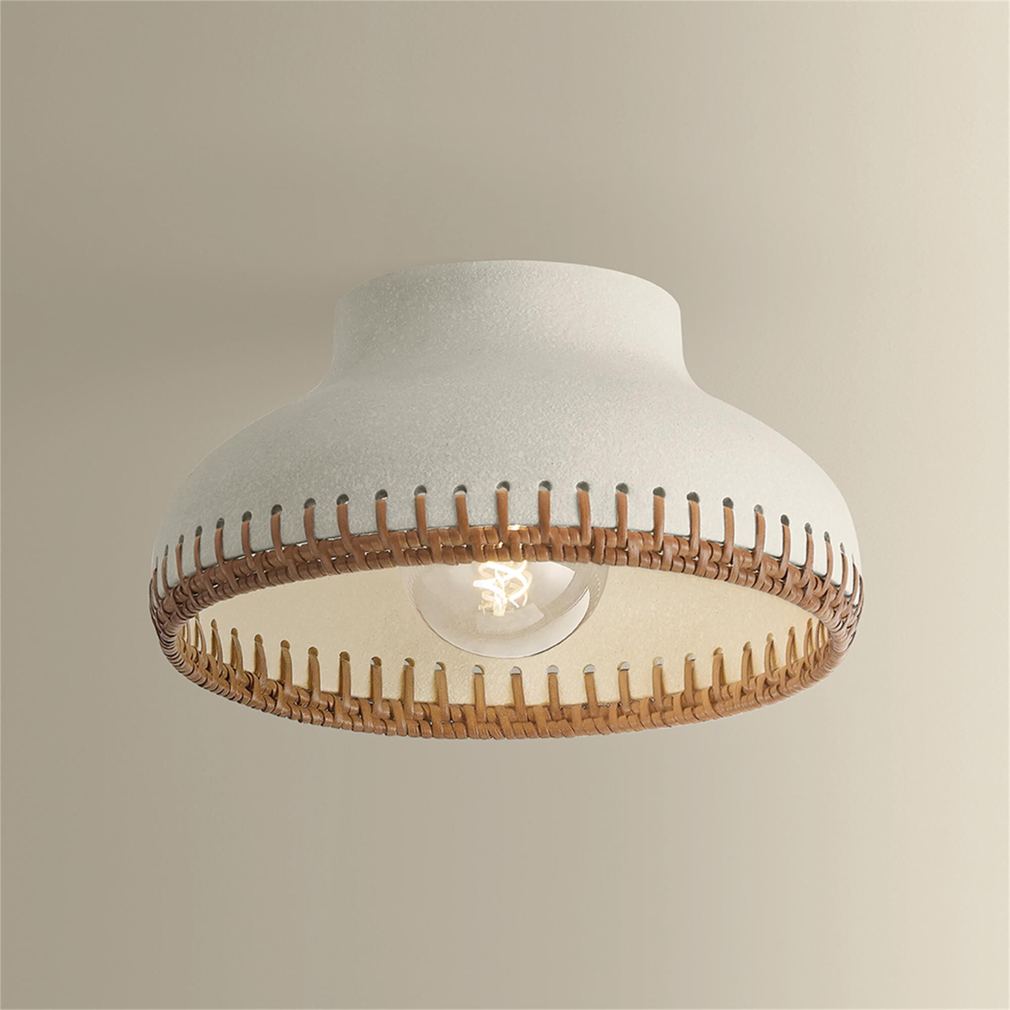Shown in Aged Brass and Ceramic Cream Pebble finish and Rattan Weave Ceramic shade