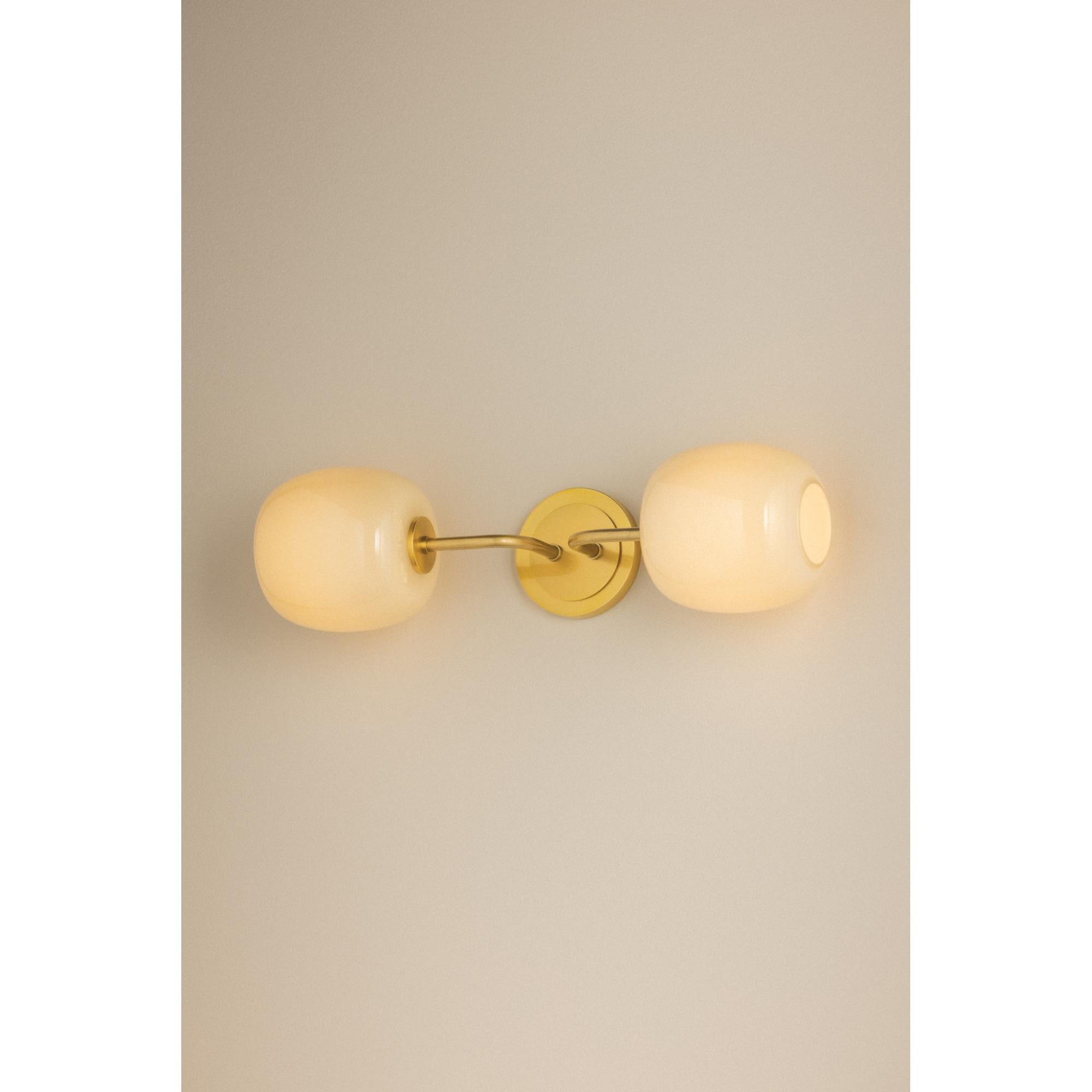 Shown in Aged Brass finish and Cream Opal glass