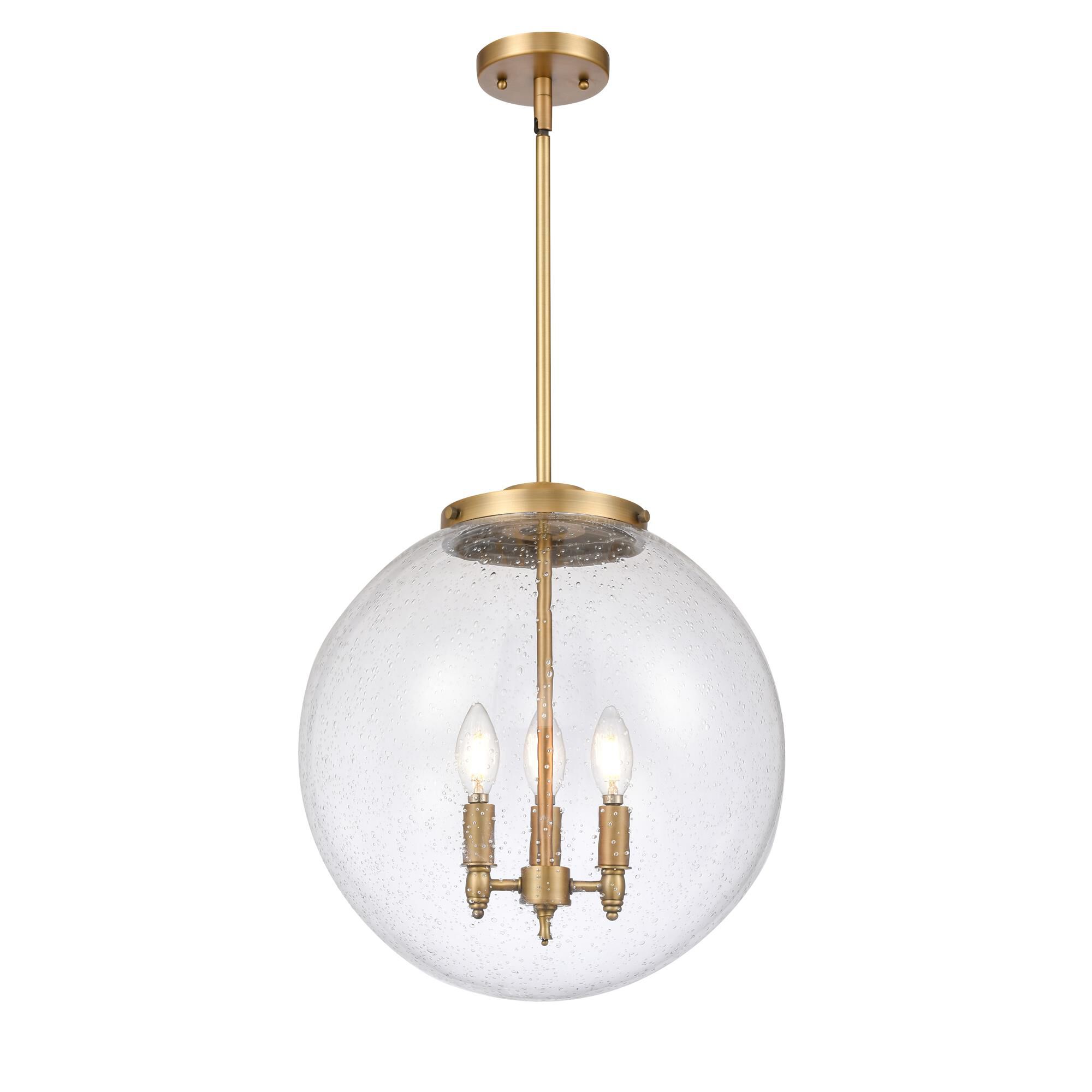 Shown in Brushed Brass finish and Seedy glass