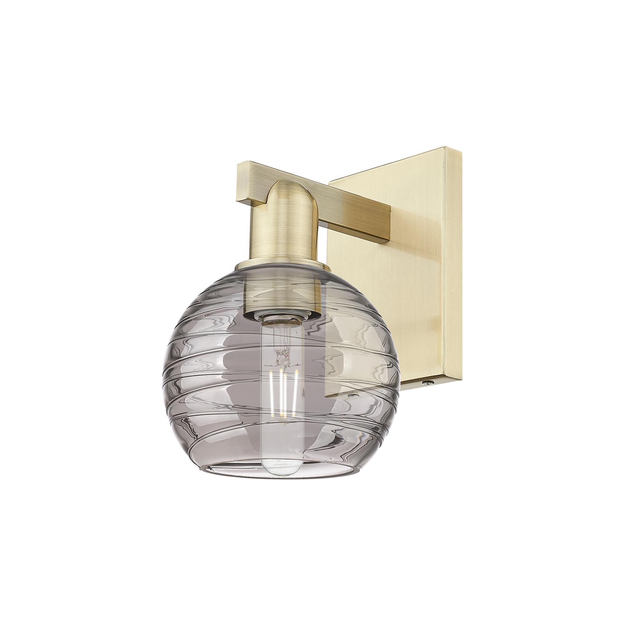 Shown in Antique Brass finish and Light Smoke Deco Swirl glass